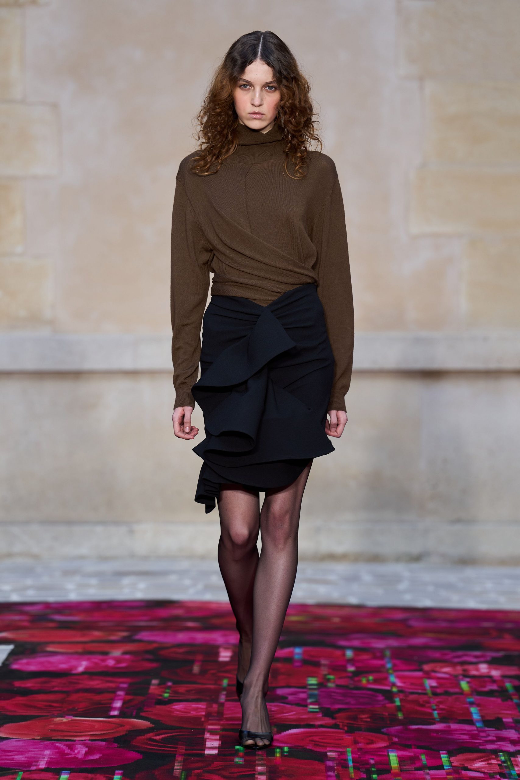 brown fitted top with black skirt