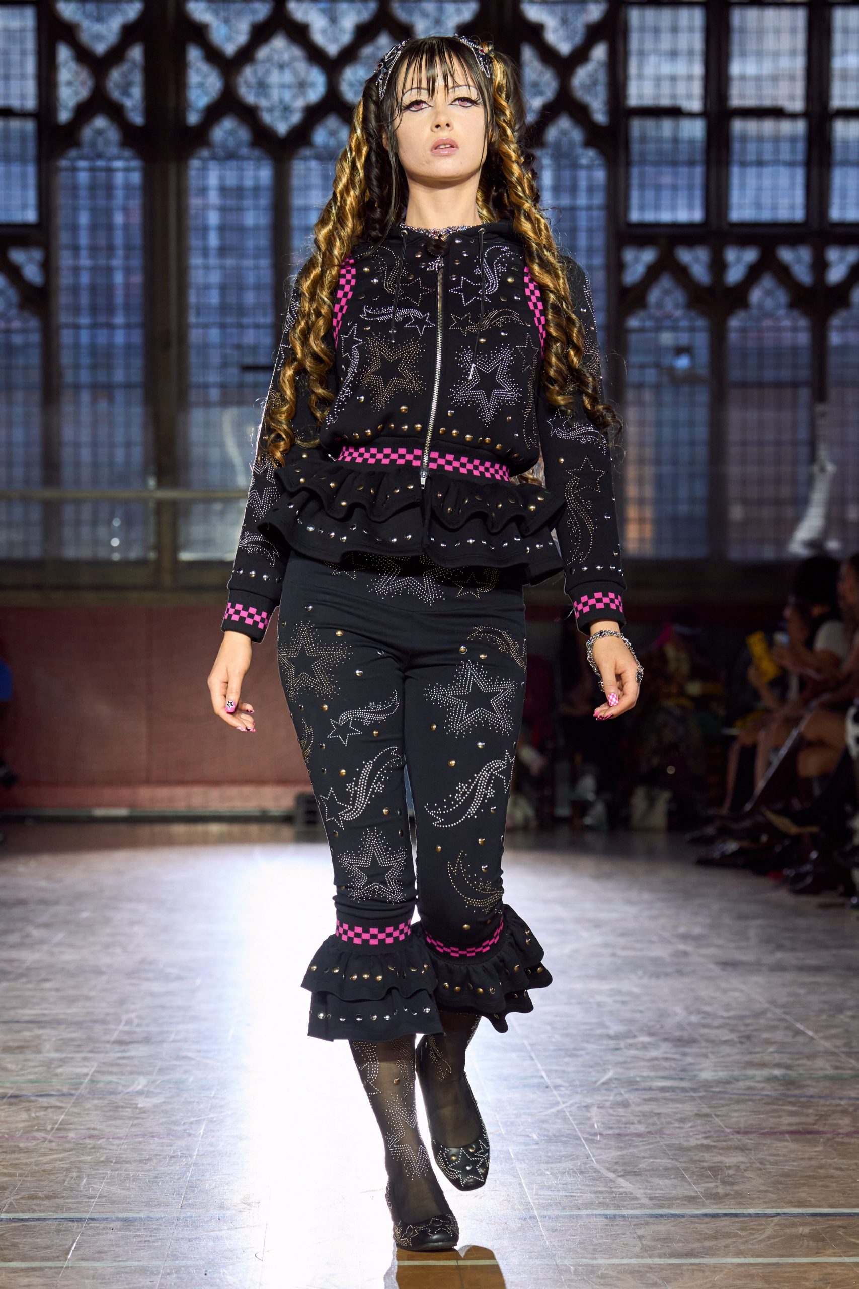 black embroidered jacket and flared pants