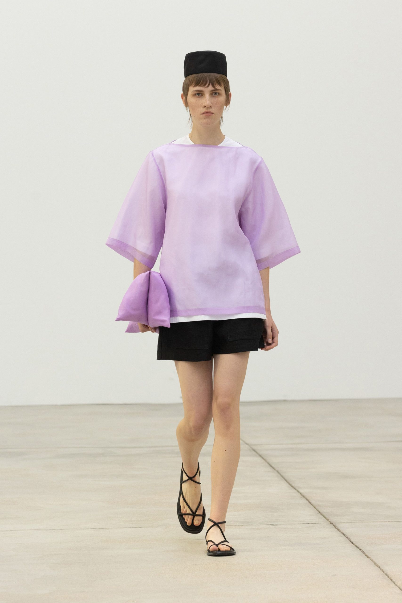 purple chiffon top with black shorts