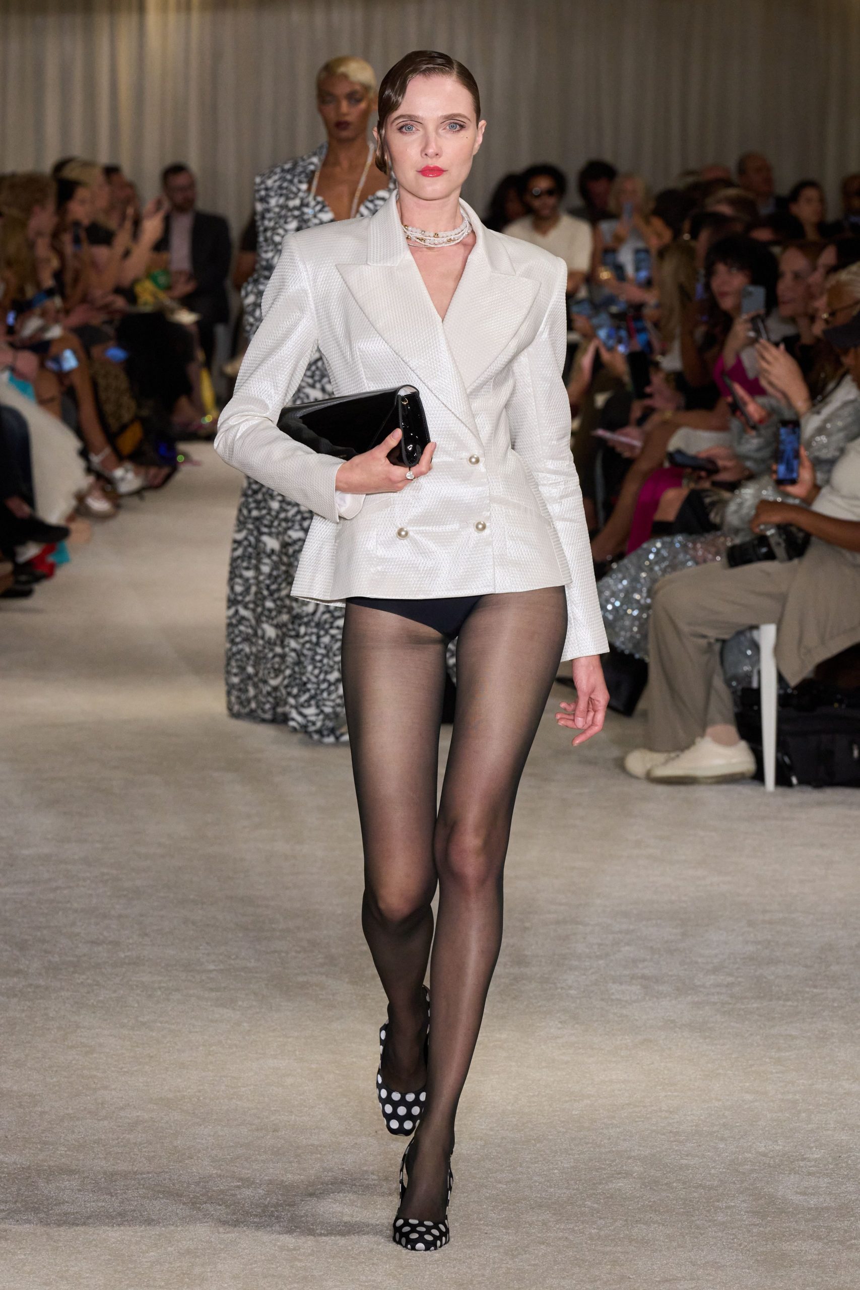 white tailored blazer with black shorts
