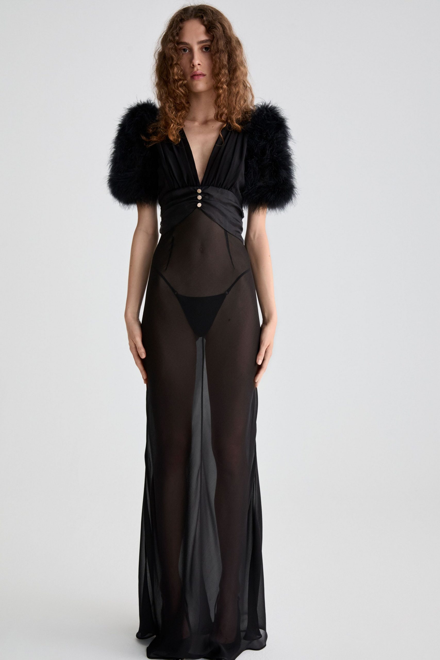 black sheer gown with faux-fur sleeves