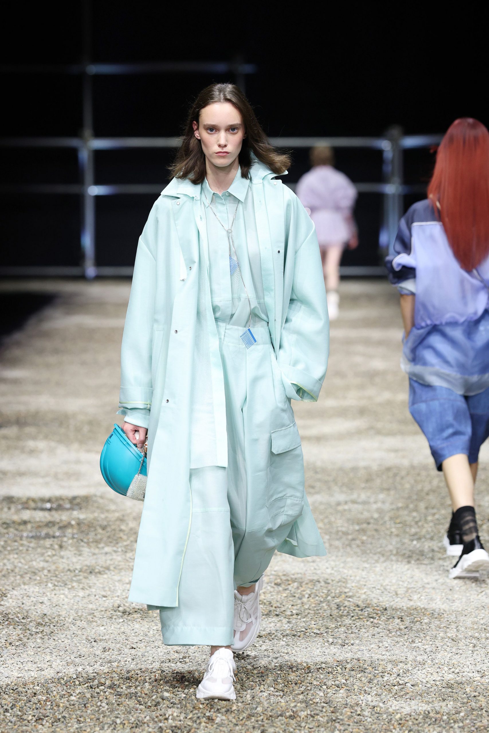 light blue relaxed coat with teal bag