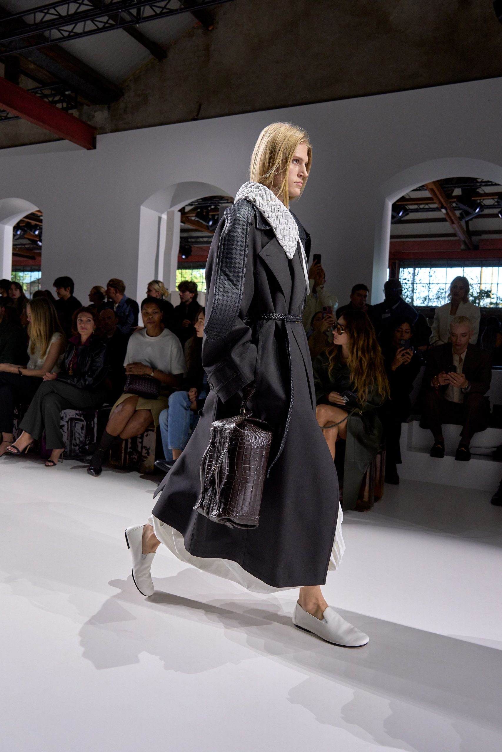 black coat white top white shoes