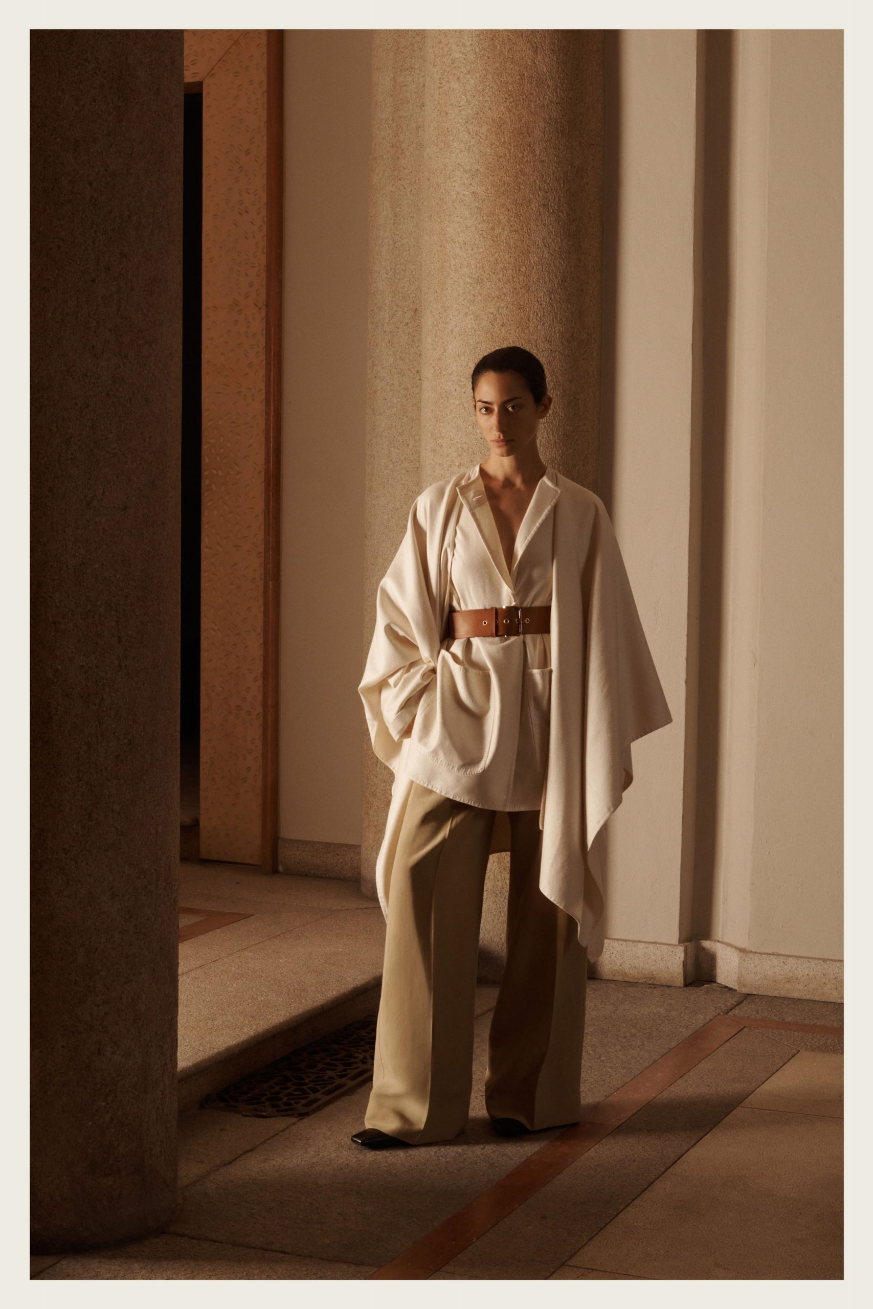 white cotton poncho with beige pants