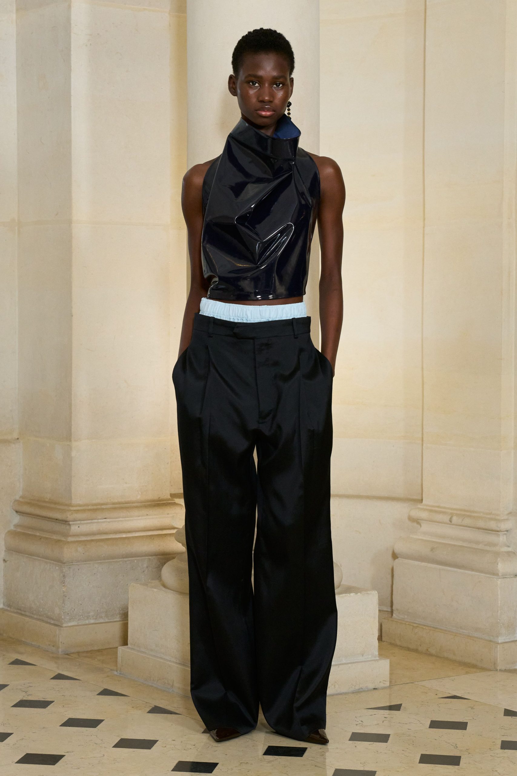 black vinyl sleeveless high-neck fitted ruffled shiny top