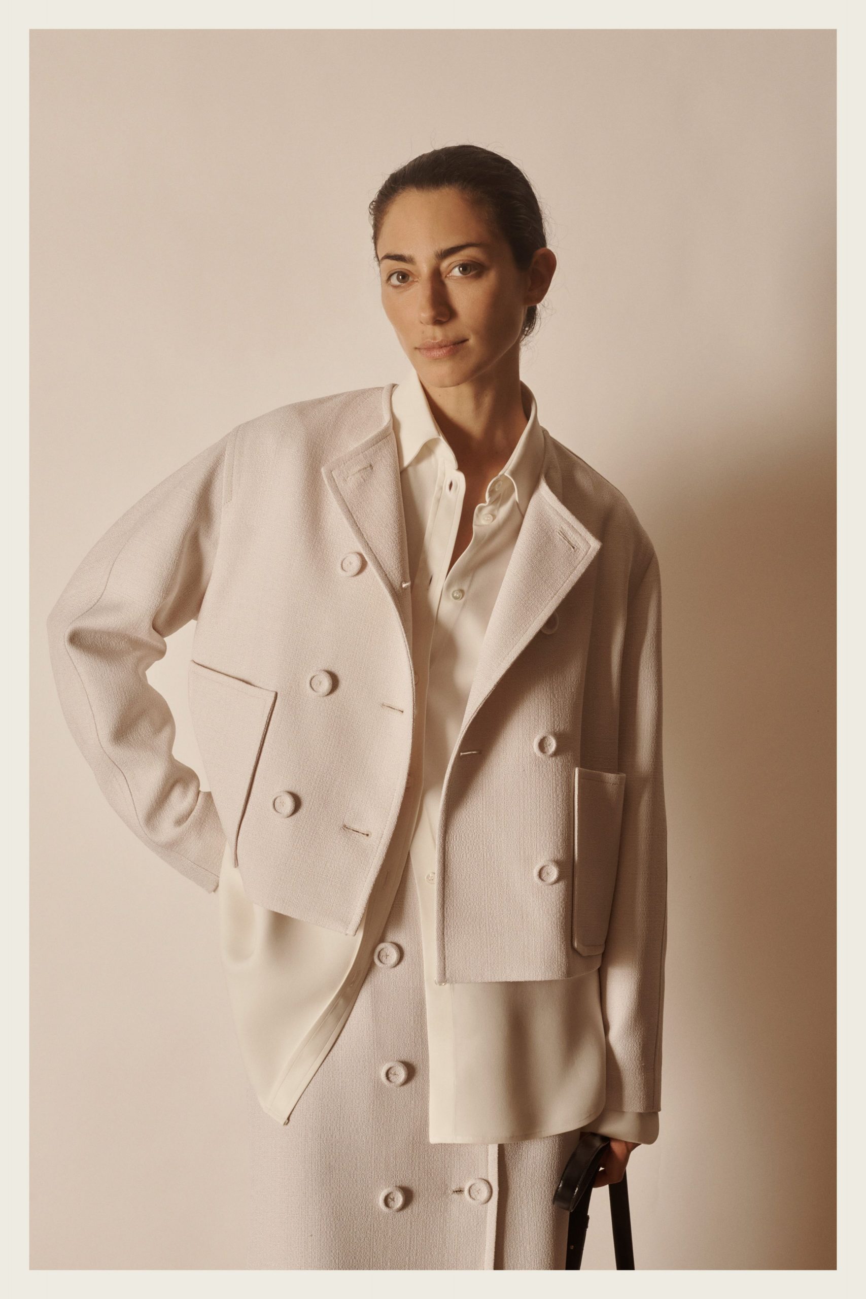 white cotton long-sleeve collared structured buttoned jacket