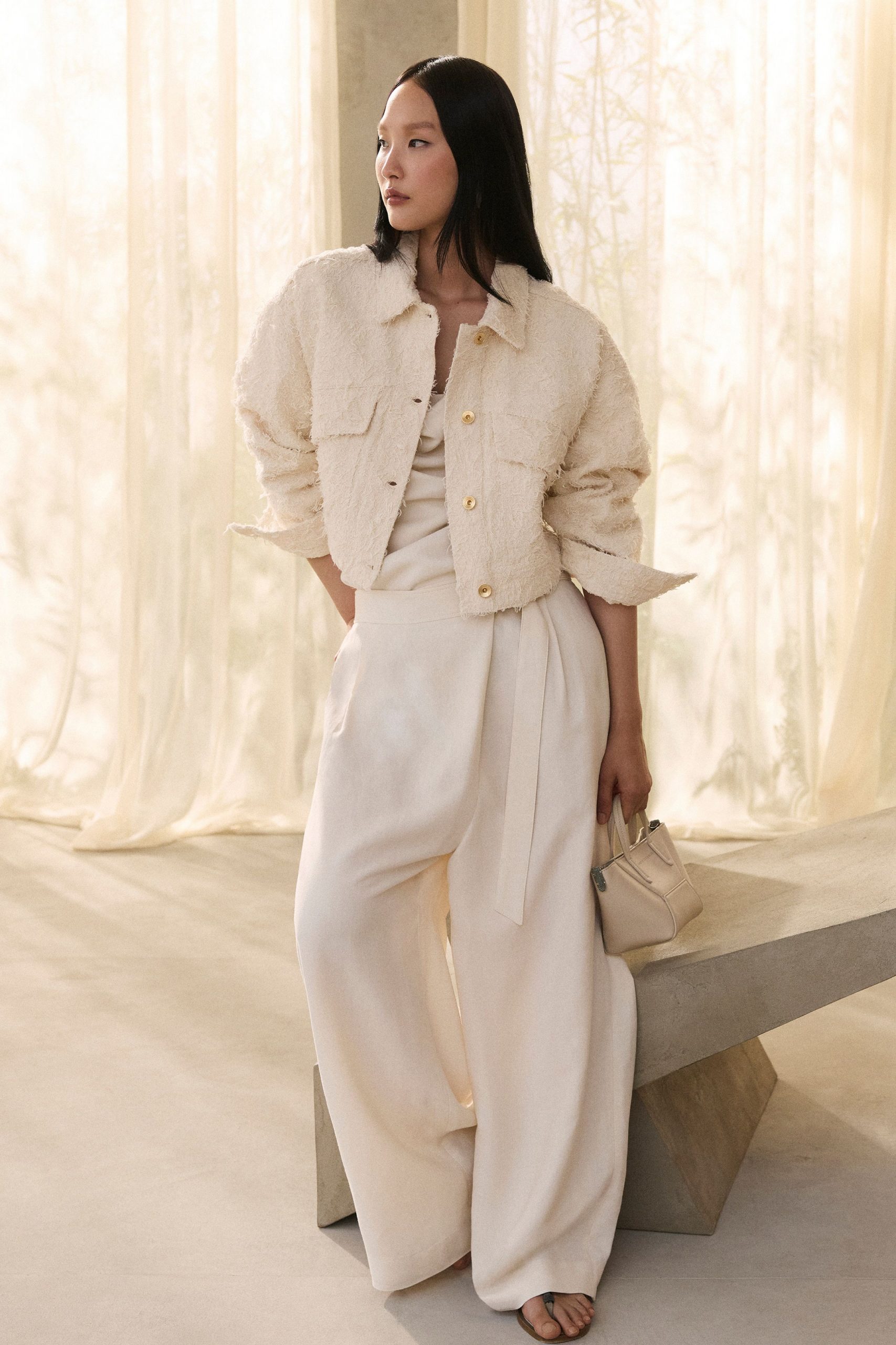 beige faux-fur jacket with wide-leg pants