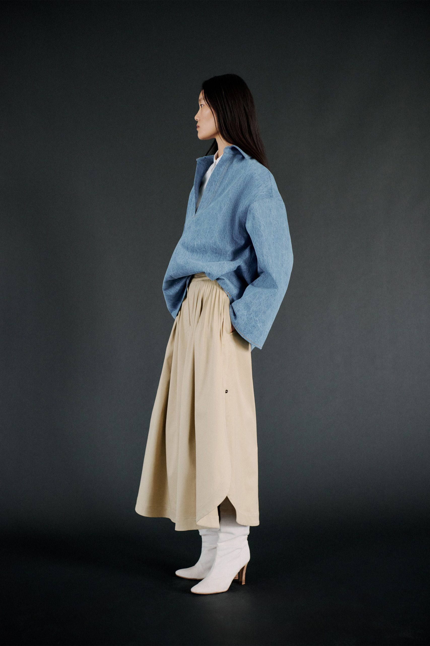 blue oversized top beige midi skirt white boots