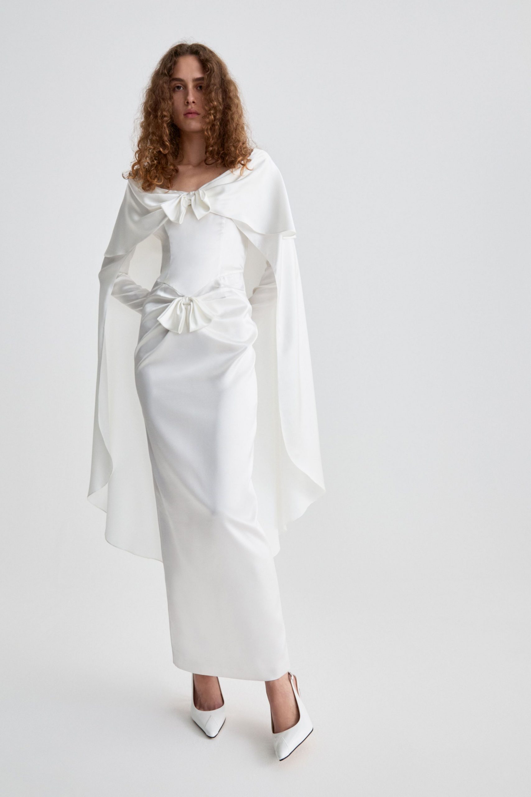 white satin sleeveless off-shoulder fitted draped belted gown