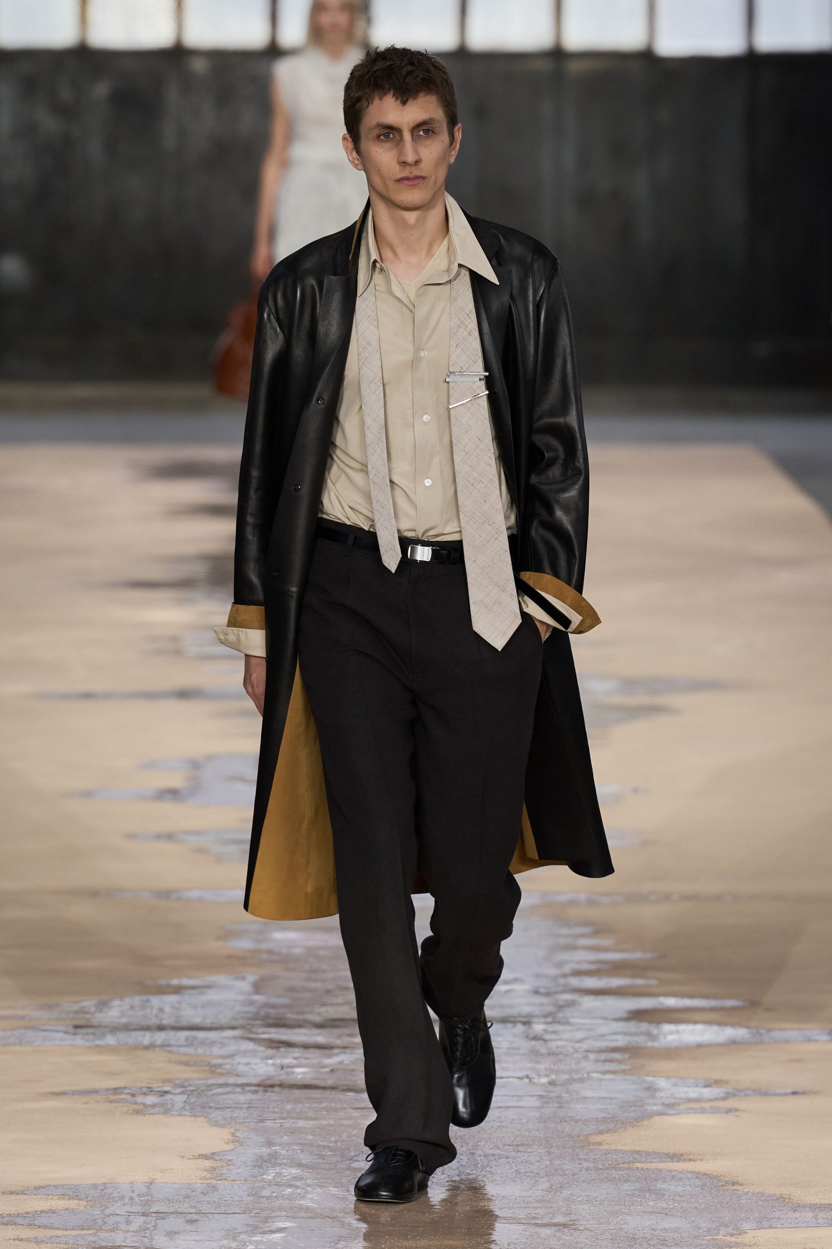 black leather coat with beige shirt