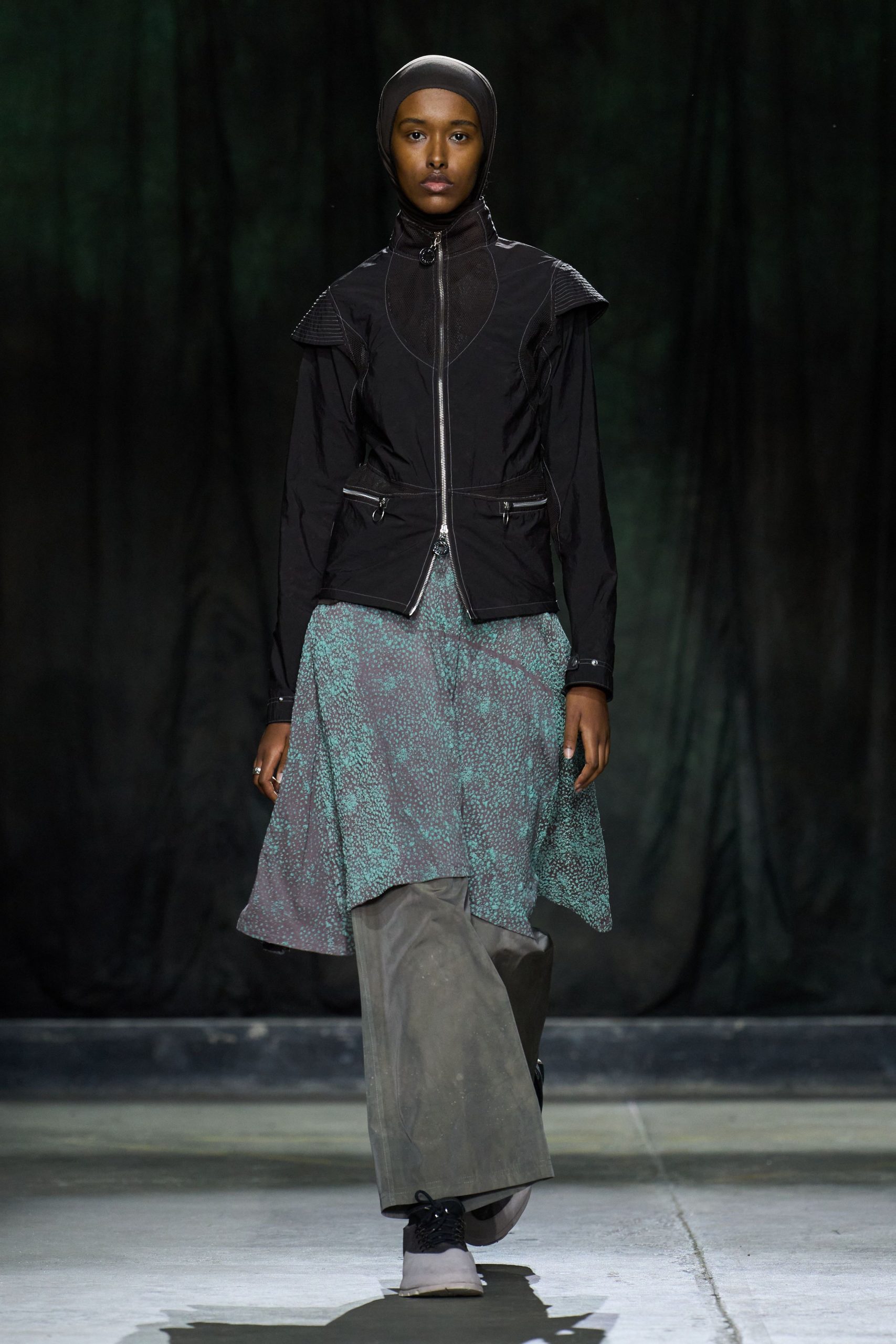 black fitted jacket with layered skirt