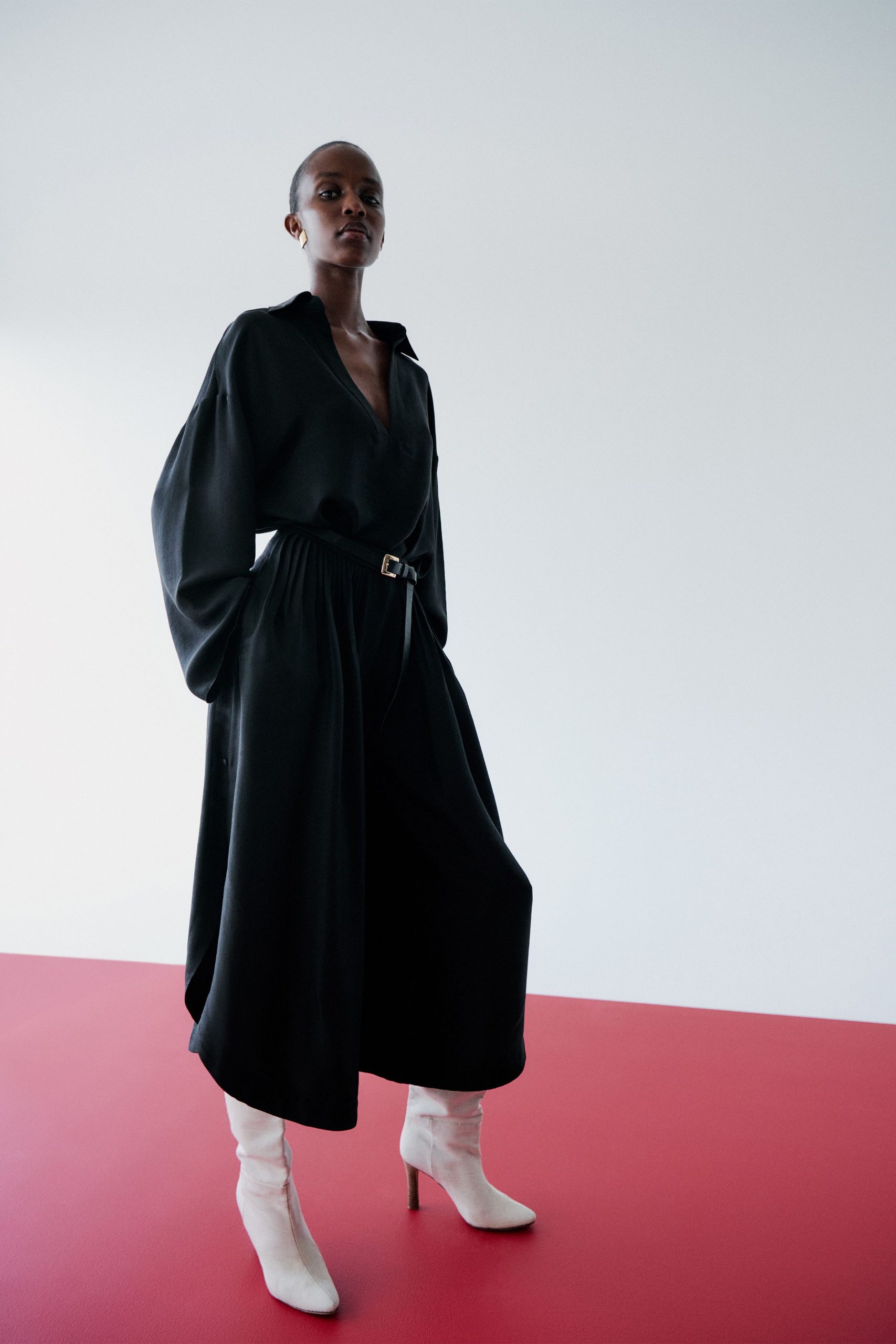 black relaxed midi dress with white boots