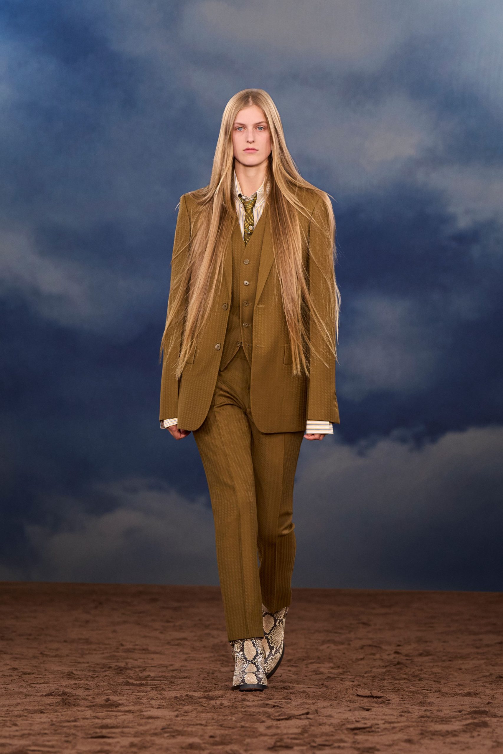 brown tailored suit with snakeskin shoes