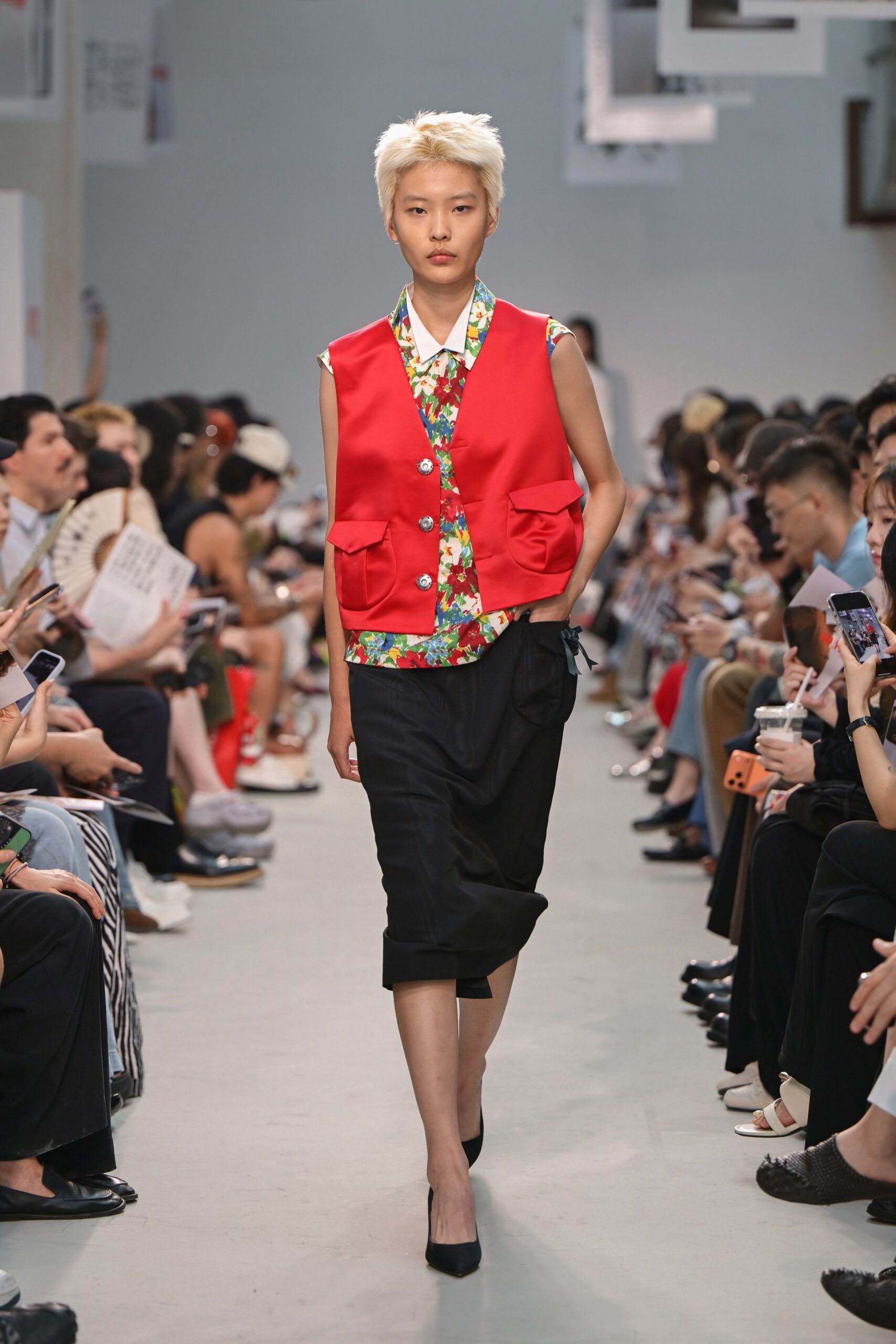 red floral vest with black pants