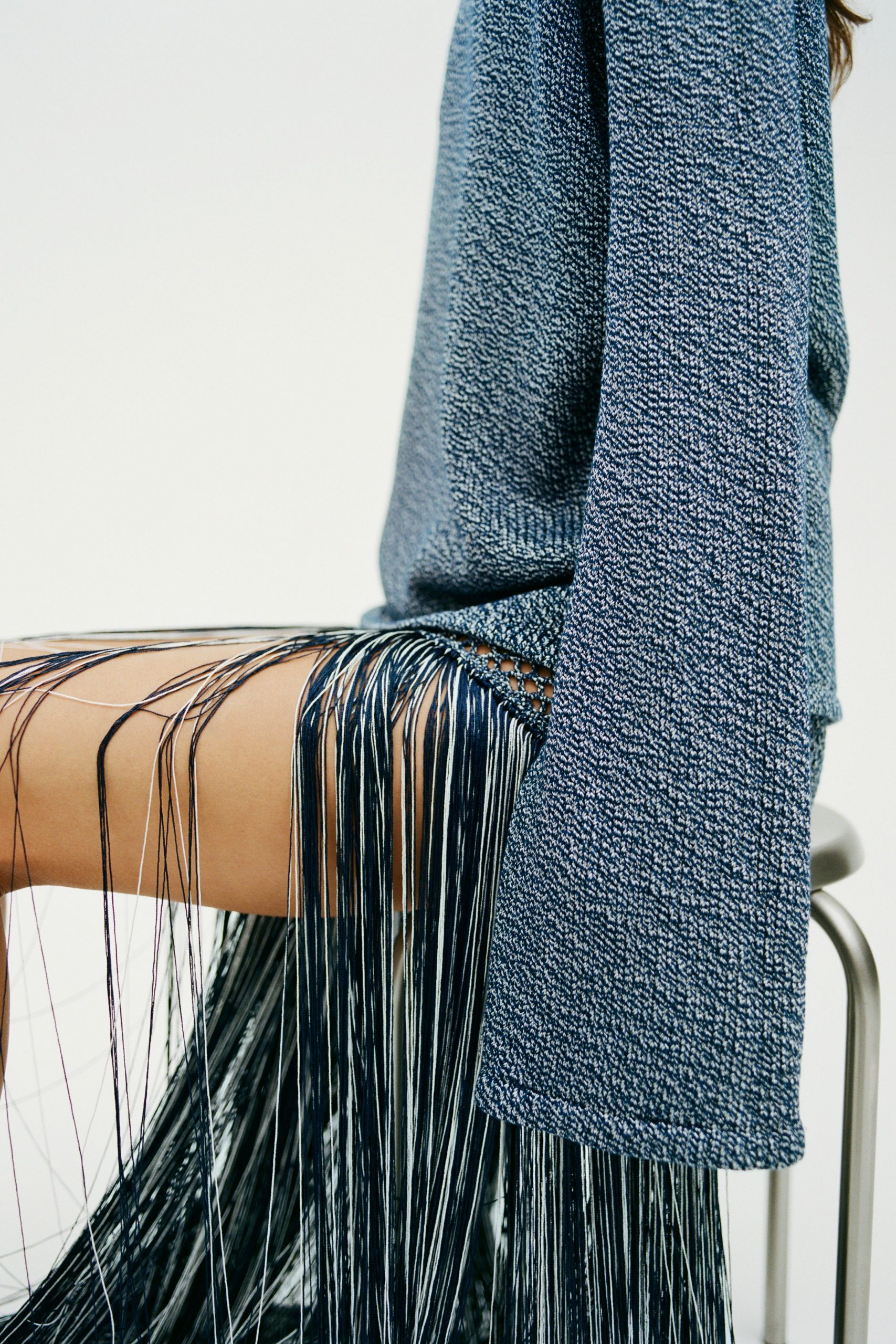 blue relaxed top with fringed skirt