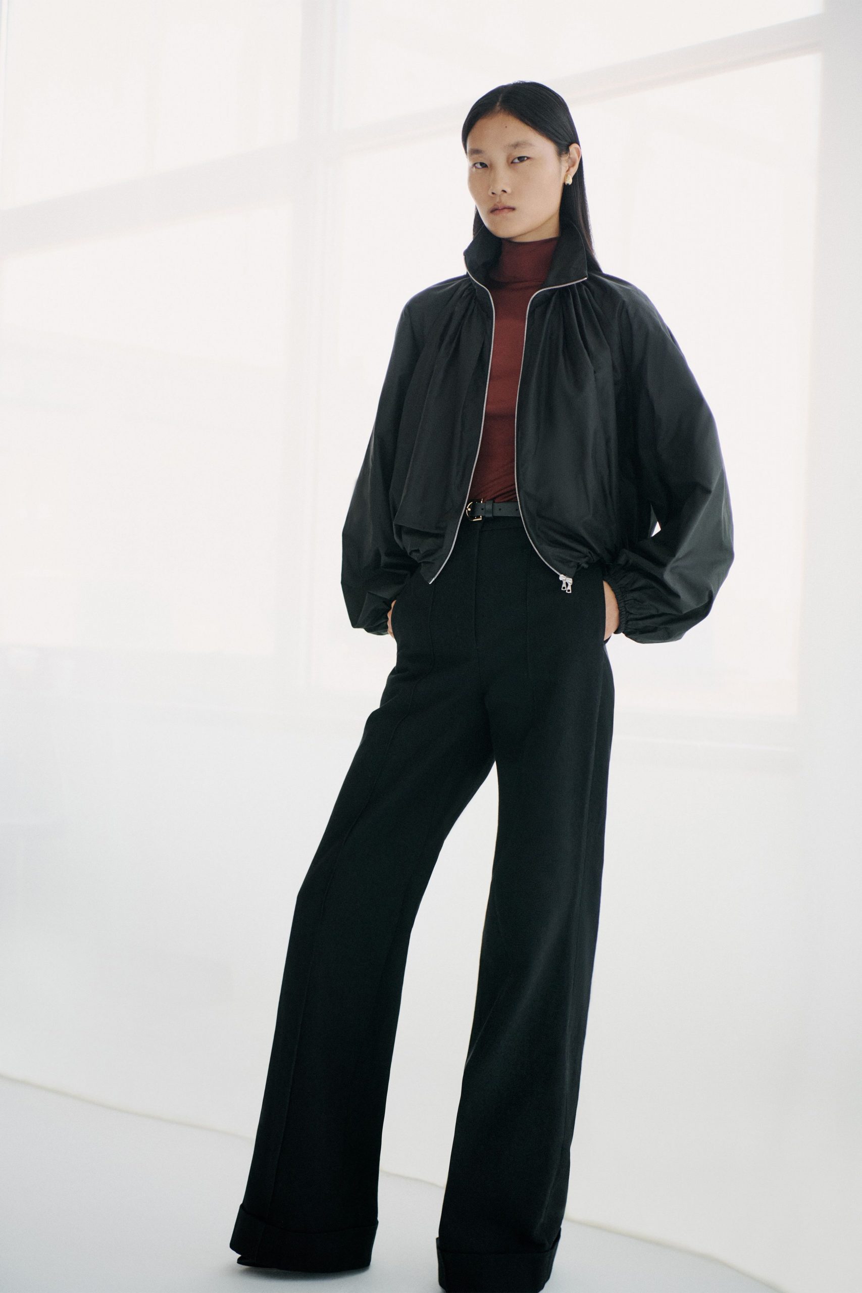 black jacket red top tailored pants