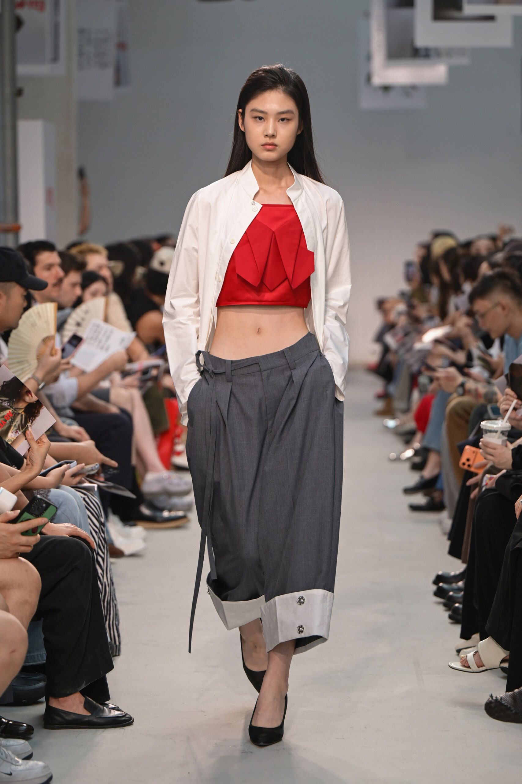 red pleated top with white jacket