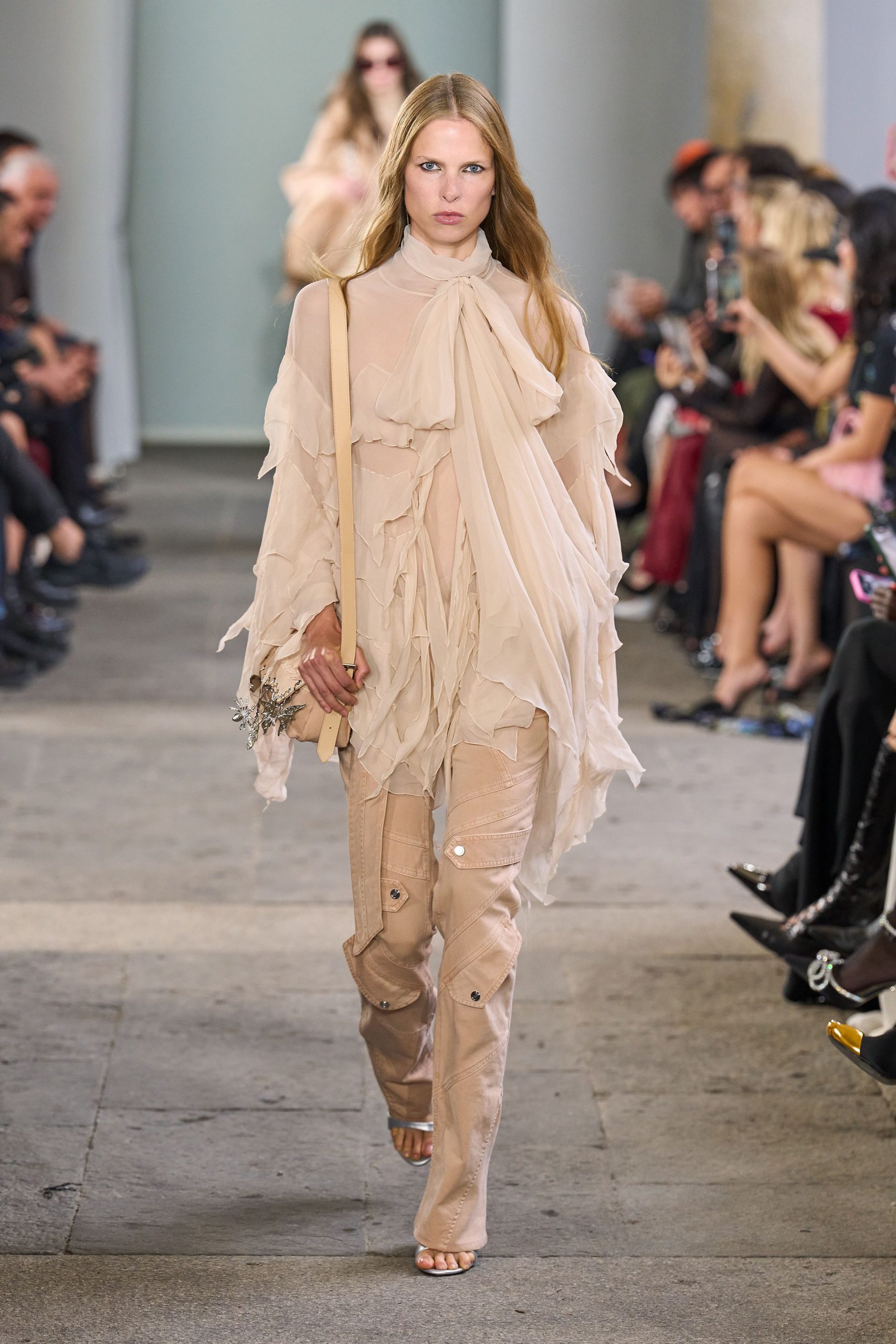 beige ruffled top with cargo pants
