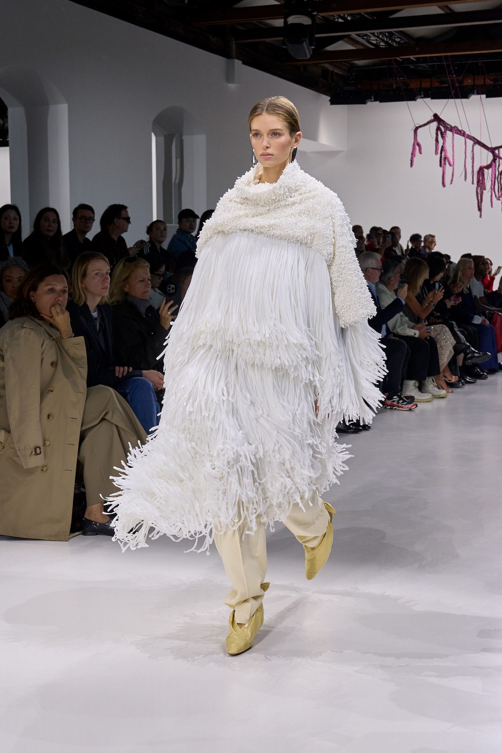 white fringed maxi dress with beige pants