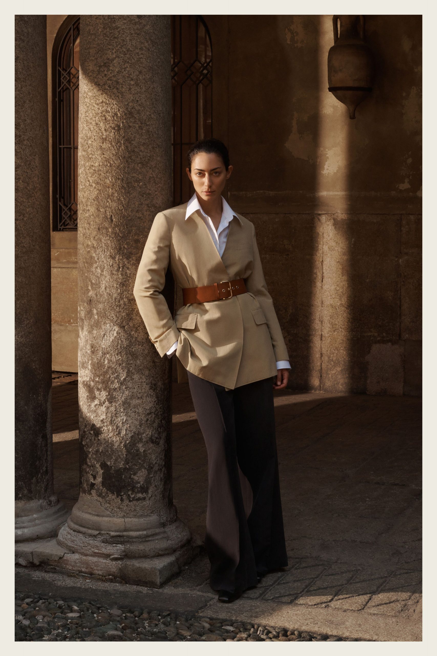 beige tailored blazer with black flared pants