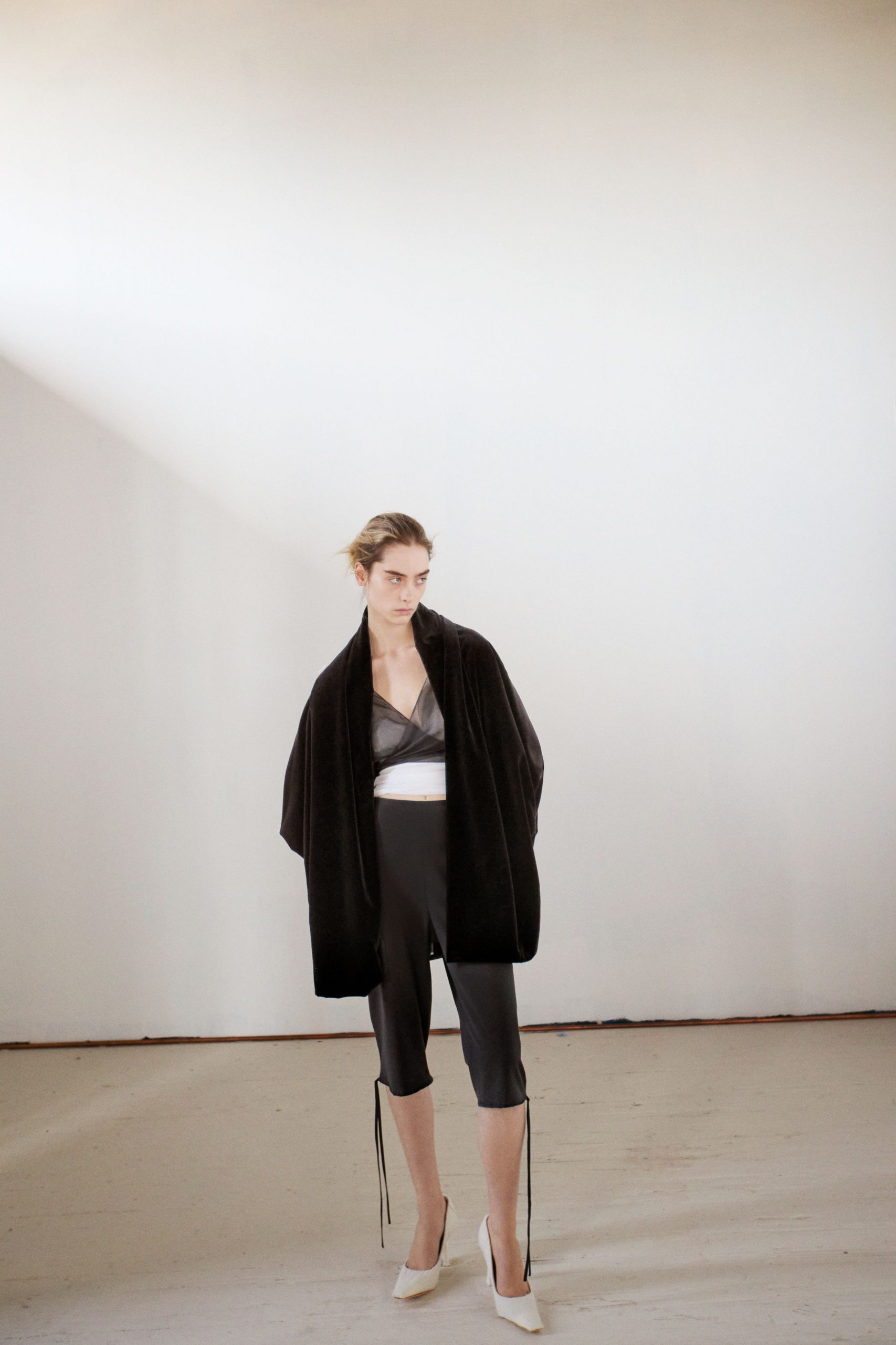 black faux-fur coat with fitted top and pants