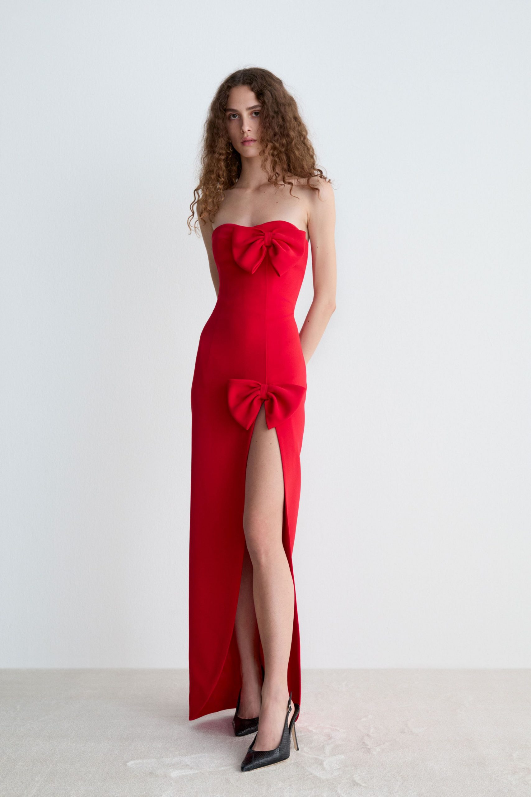 red silk strapless slit fitted draped maxi gown