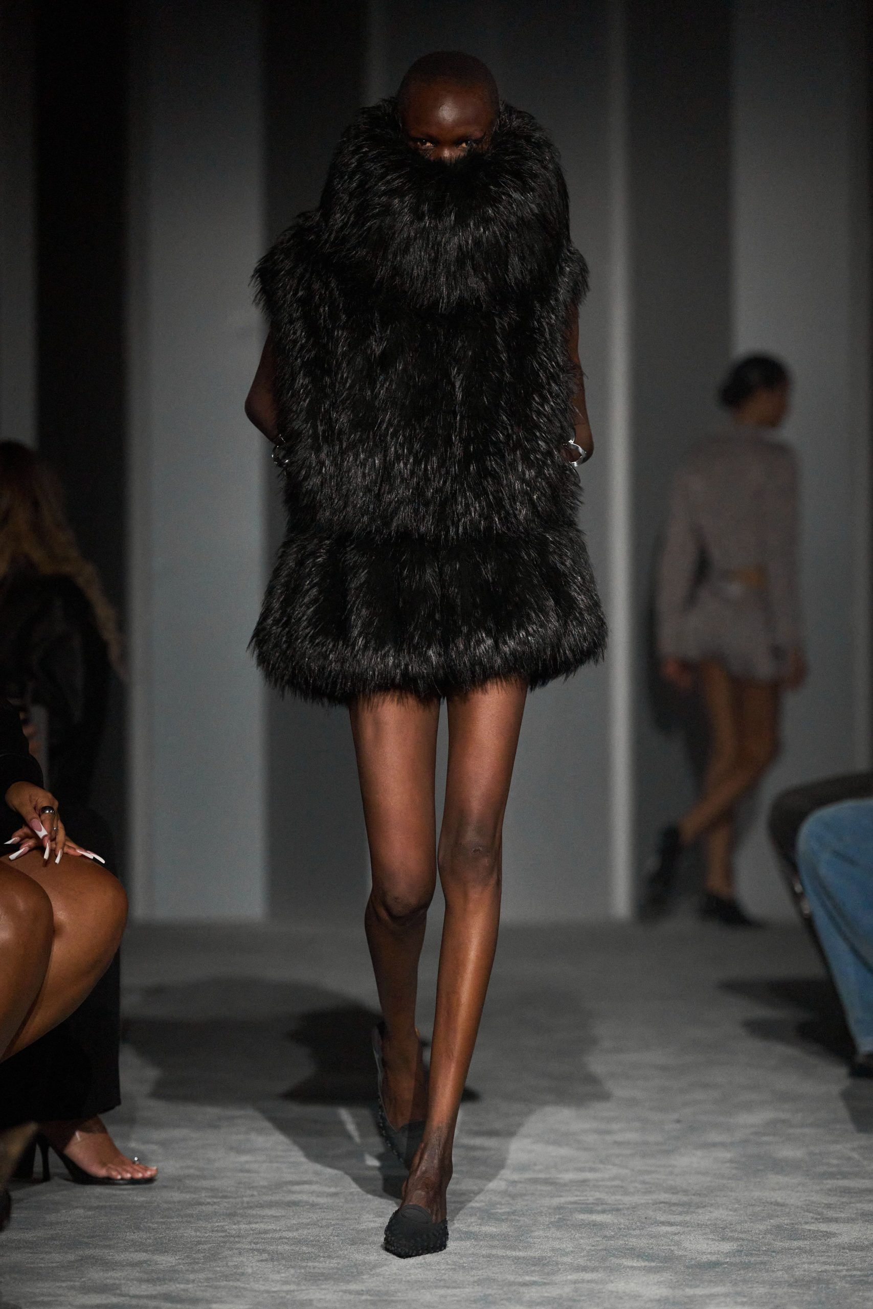 black faux-fur coat and shoes