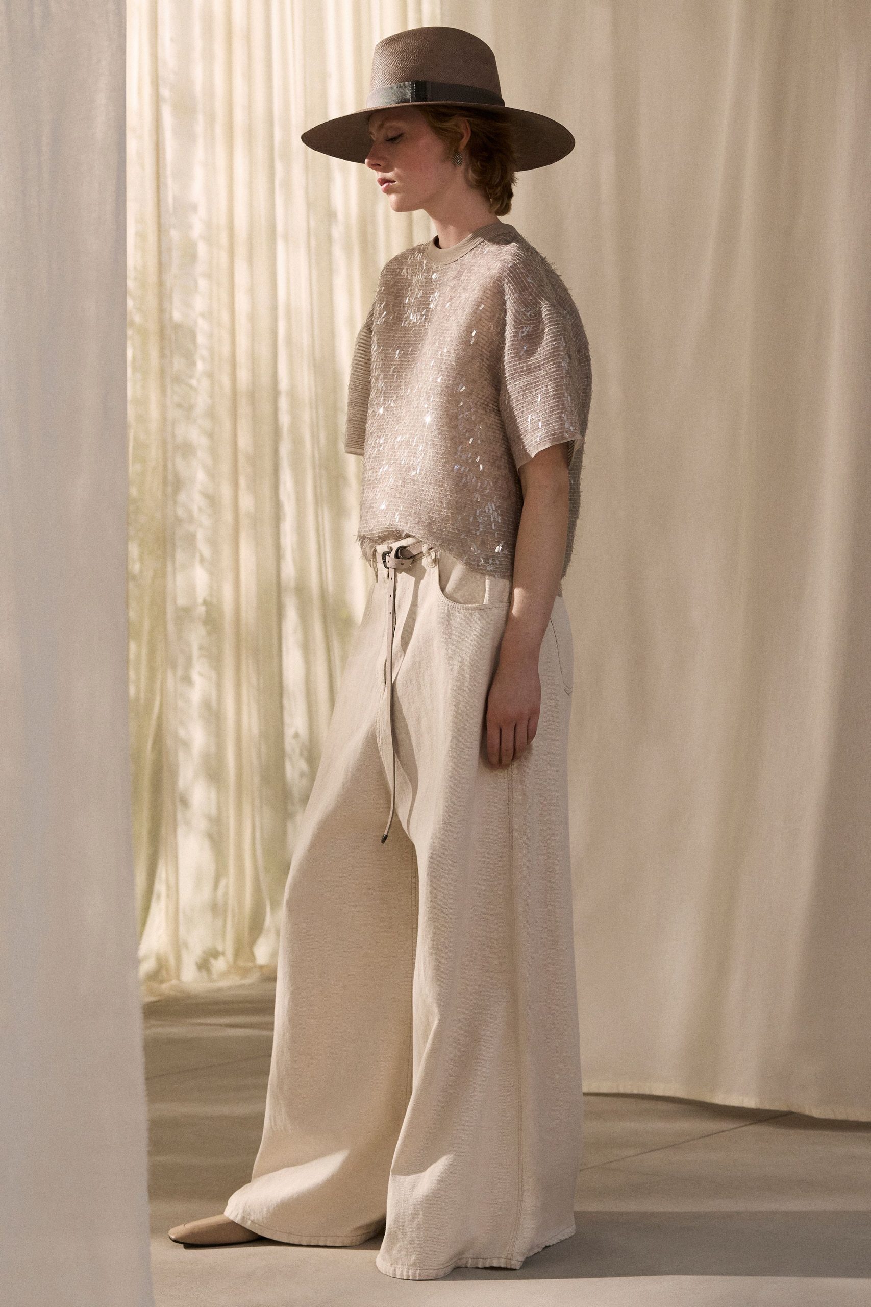 beige sequined top and wide-leg pants