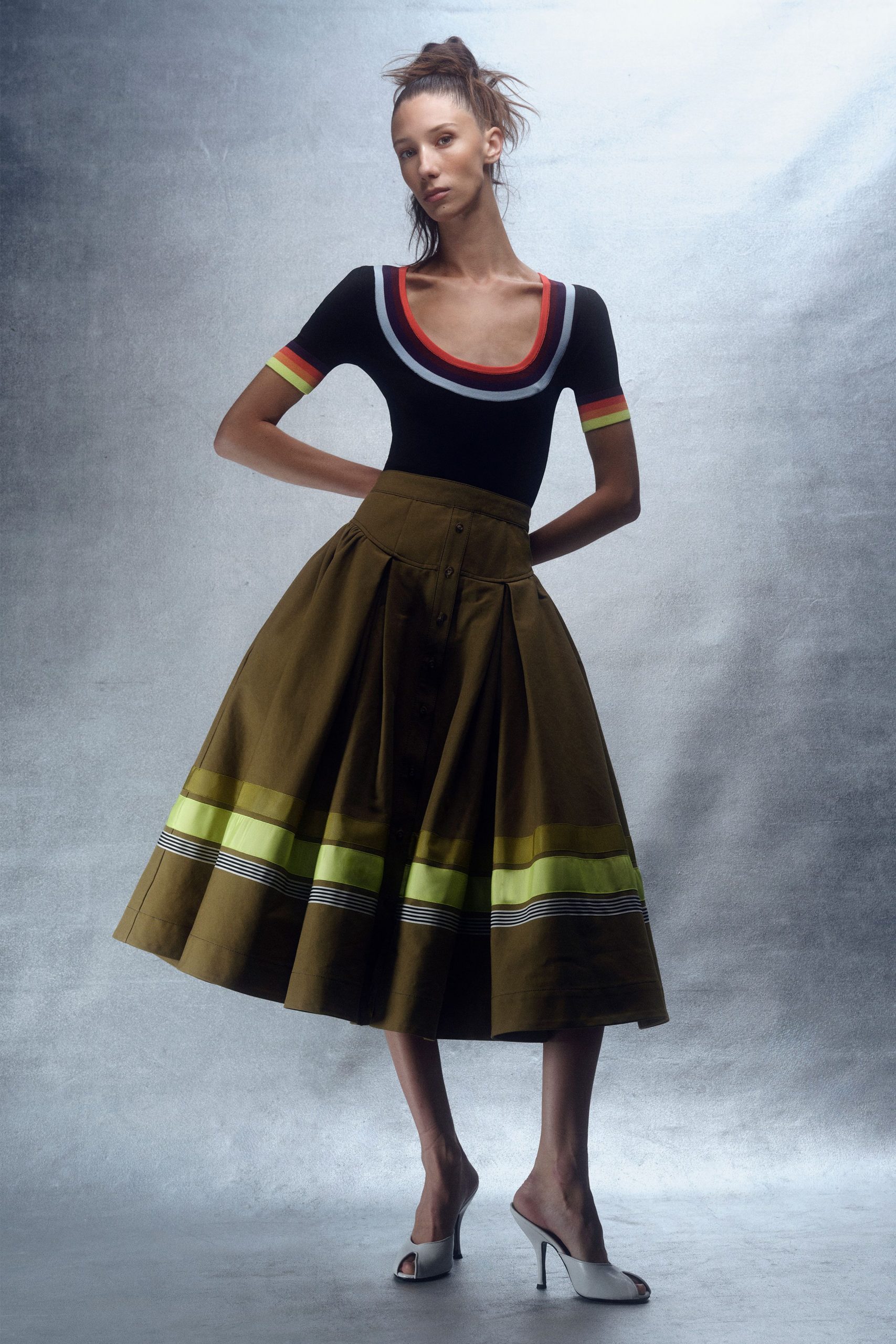 black color-blocked top with olive midi skirt
