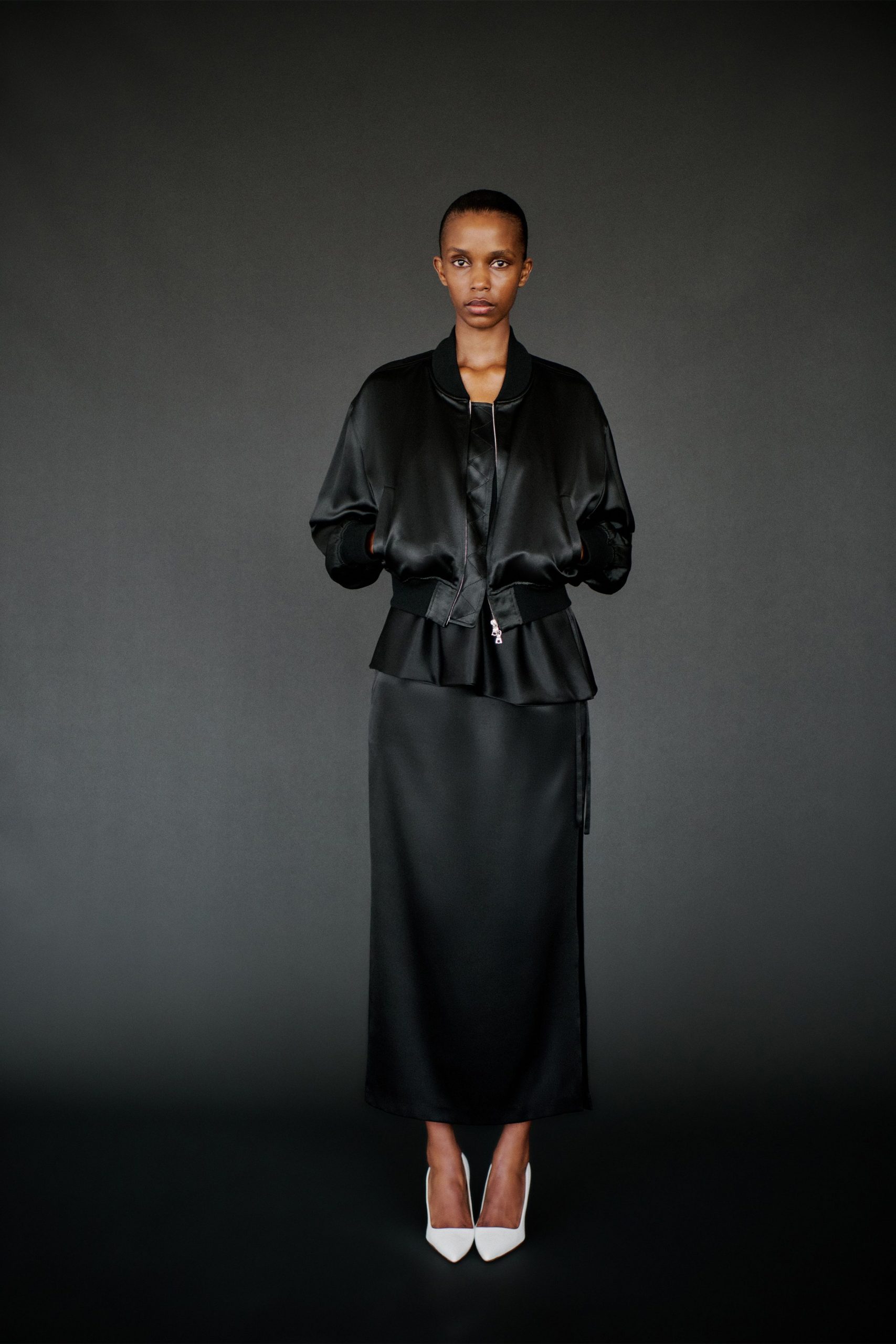 black silk fitted jacket and skirt