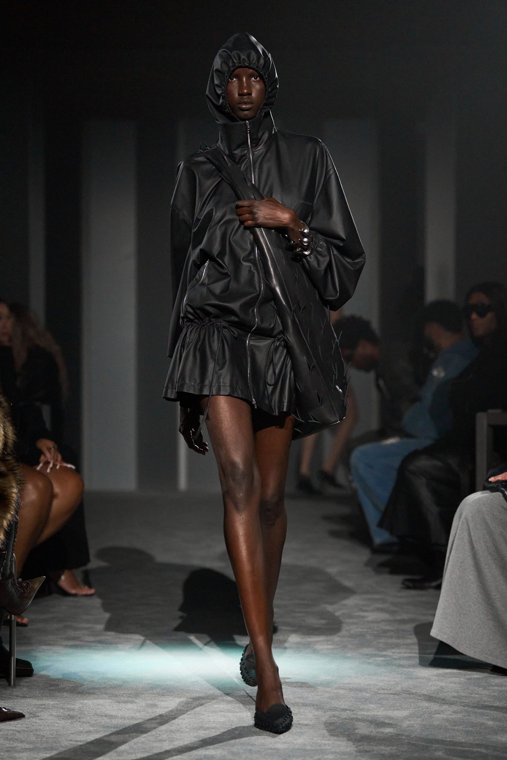 black leather long-sleeve hooded fitted zippered pleated coat
