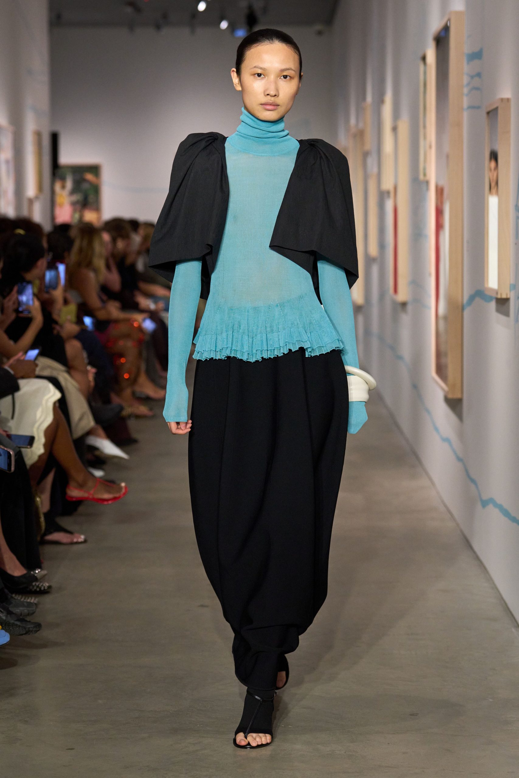 blue relaxed top with black jacket