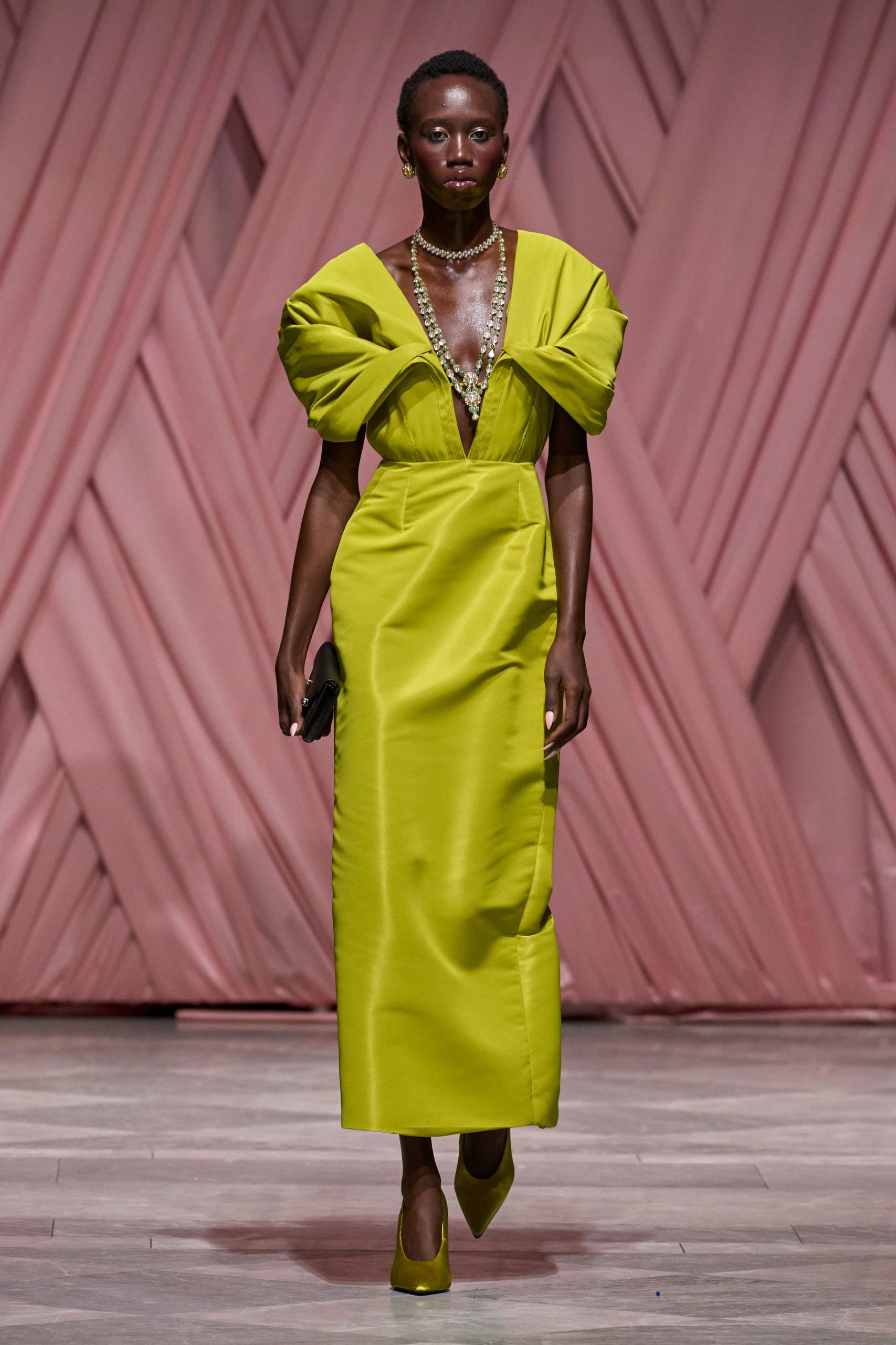 green silk short-sleeve v-neck fitted pleated draped gown