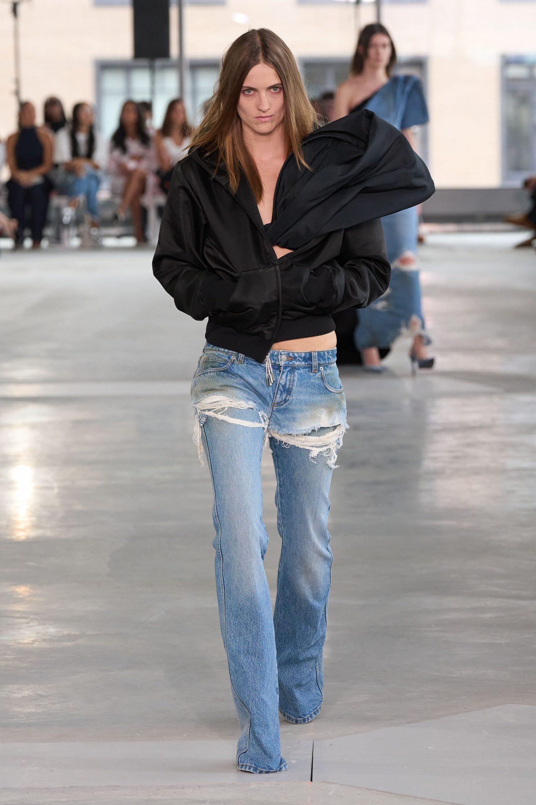black fitted jacket with distressed jeans
