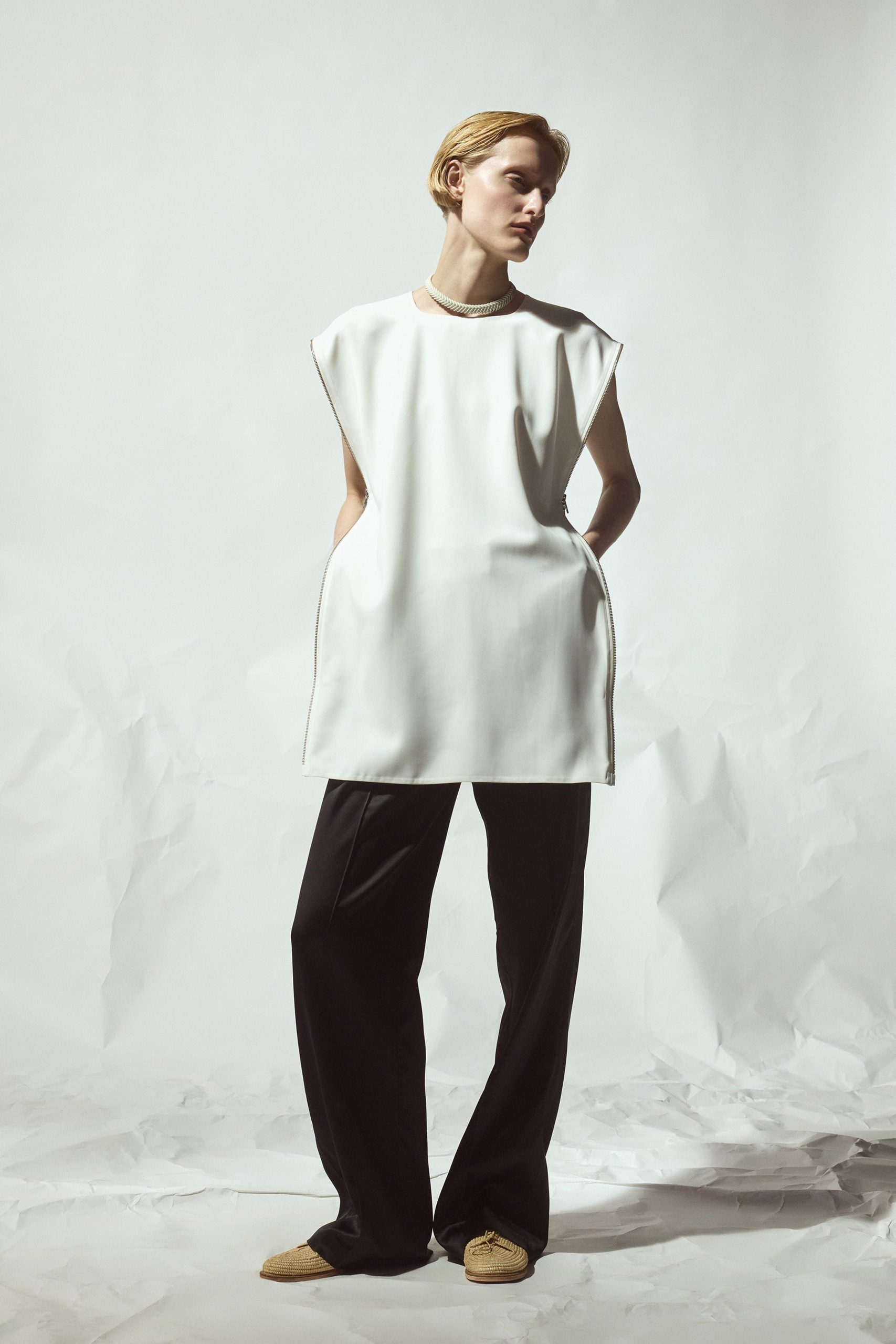 white relaxed top with black pants
