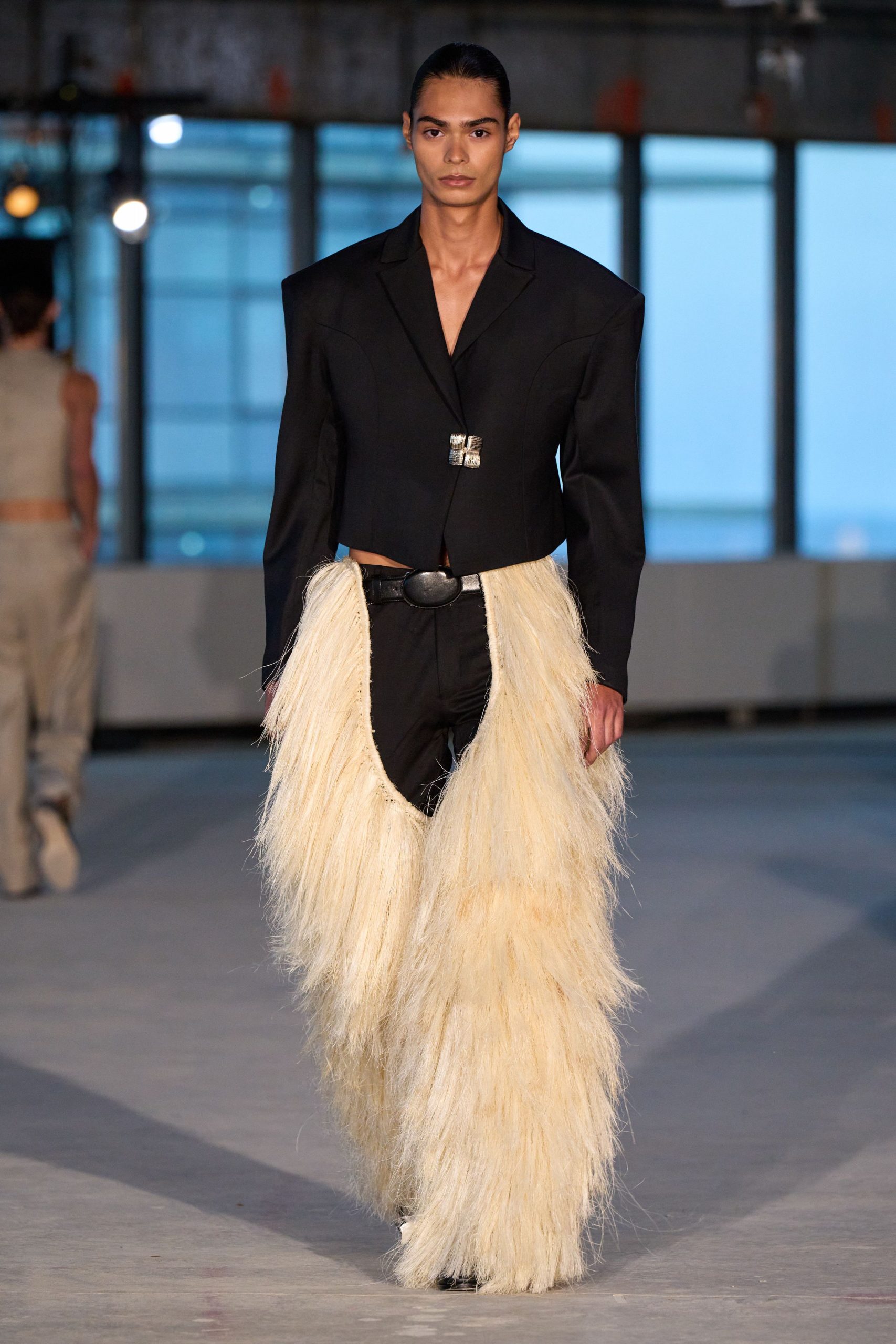 black structured blazer with fringed pants