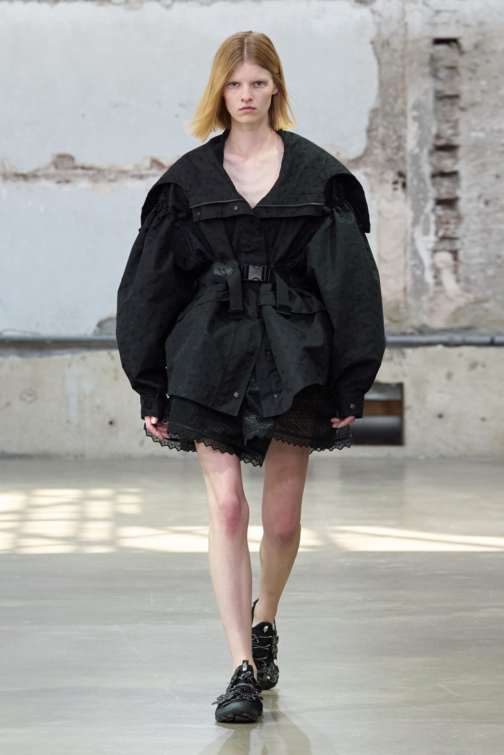 black cotton long-sleeve collared oversized zippered belted jacket