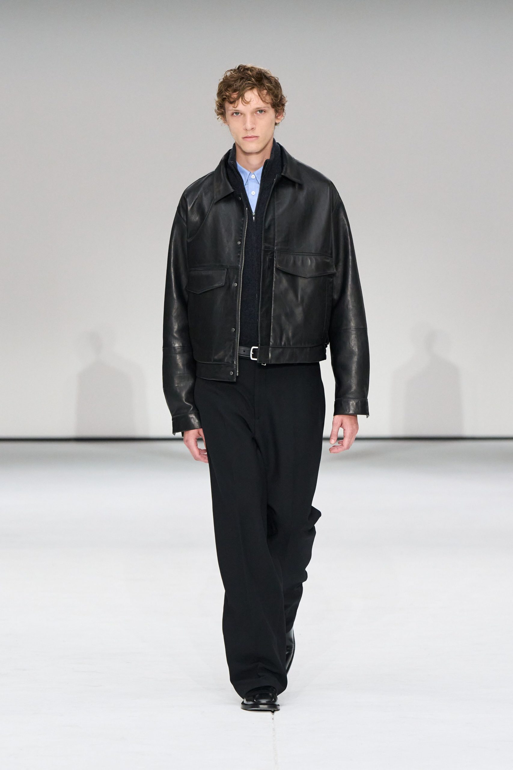 black leather jacket with blue shirt