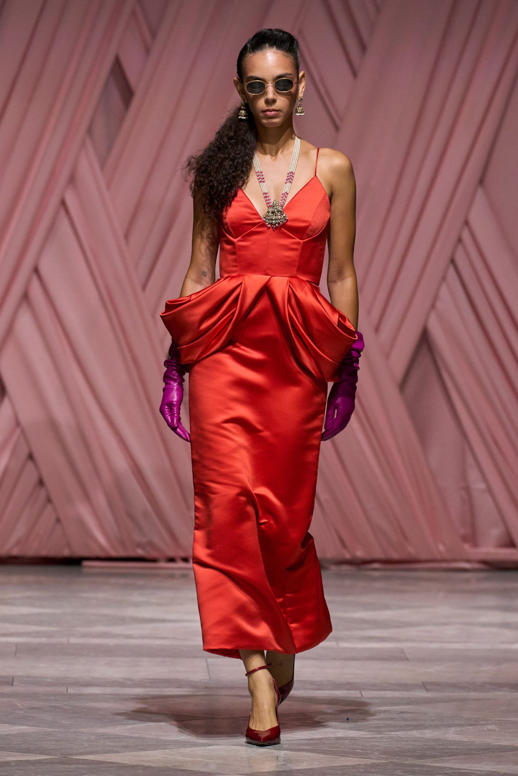 red satin sleeveless v-neck fitted pleated maxi gown