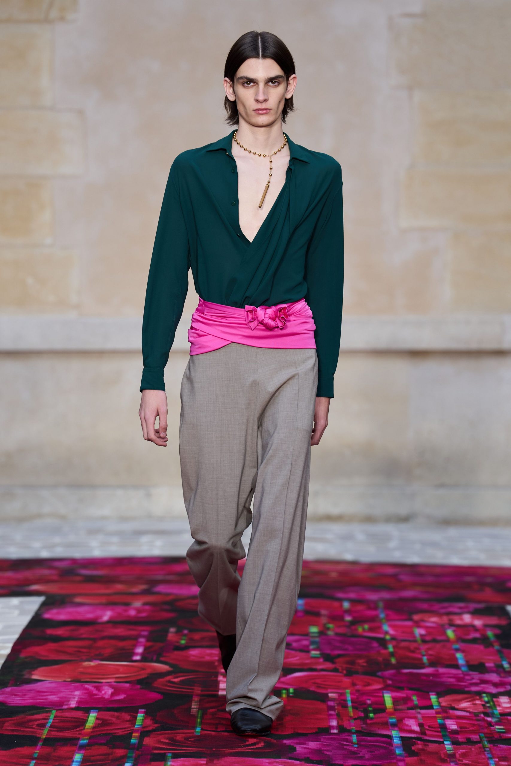 green long-sleeve shirt with beige pants