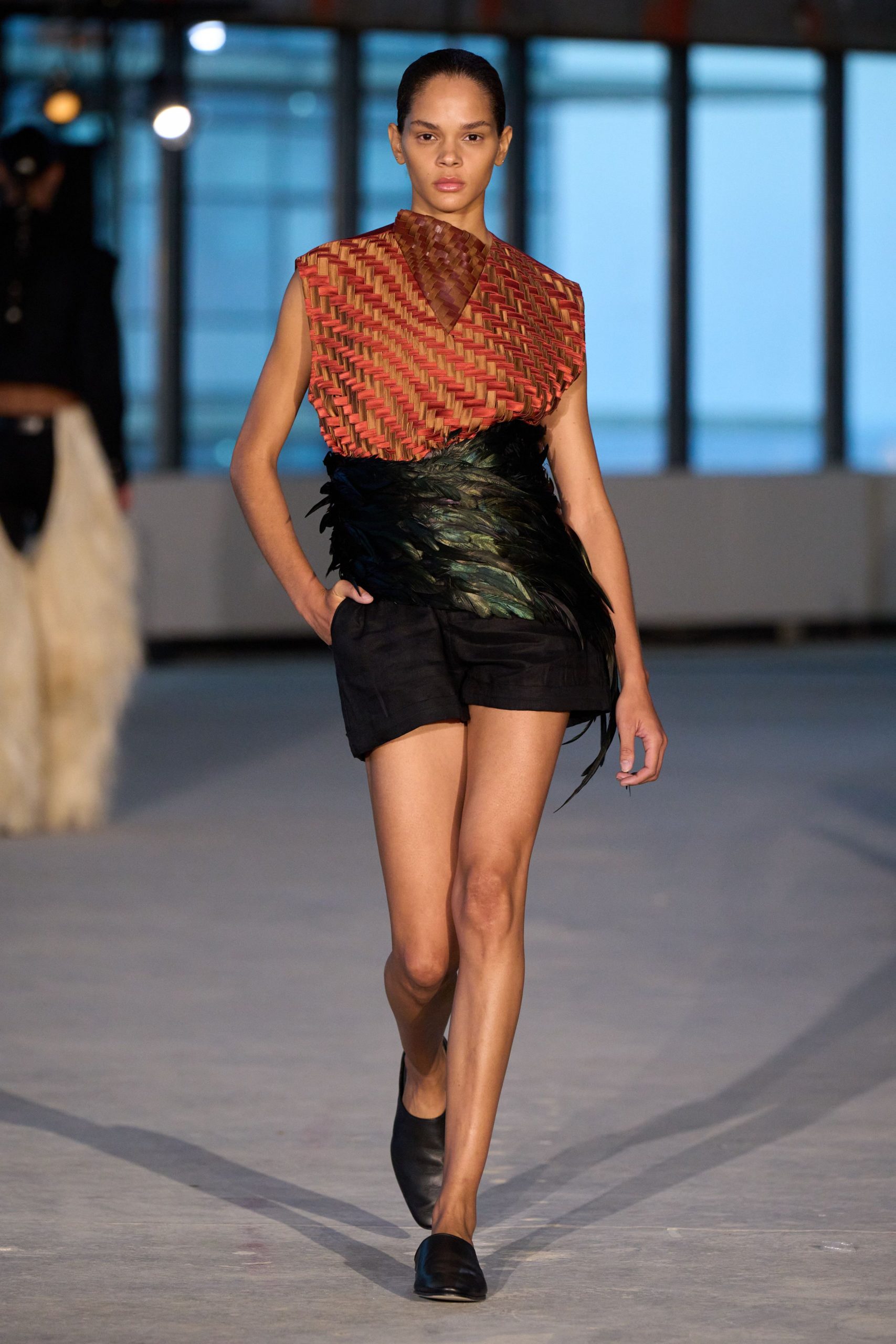 red layered top with black shorts