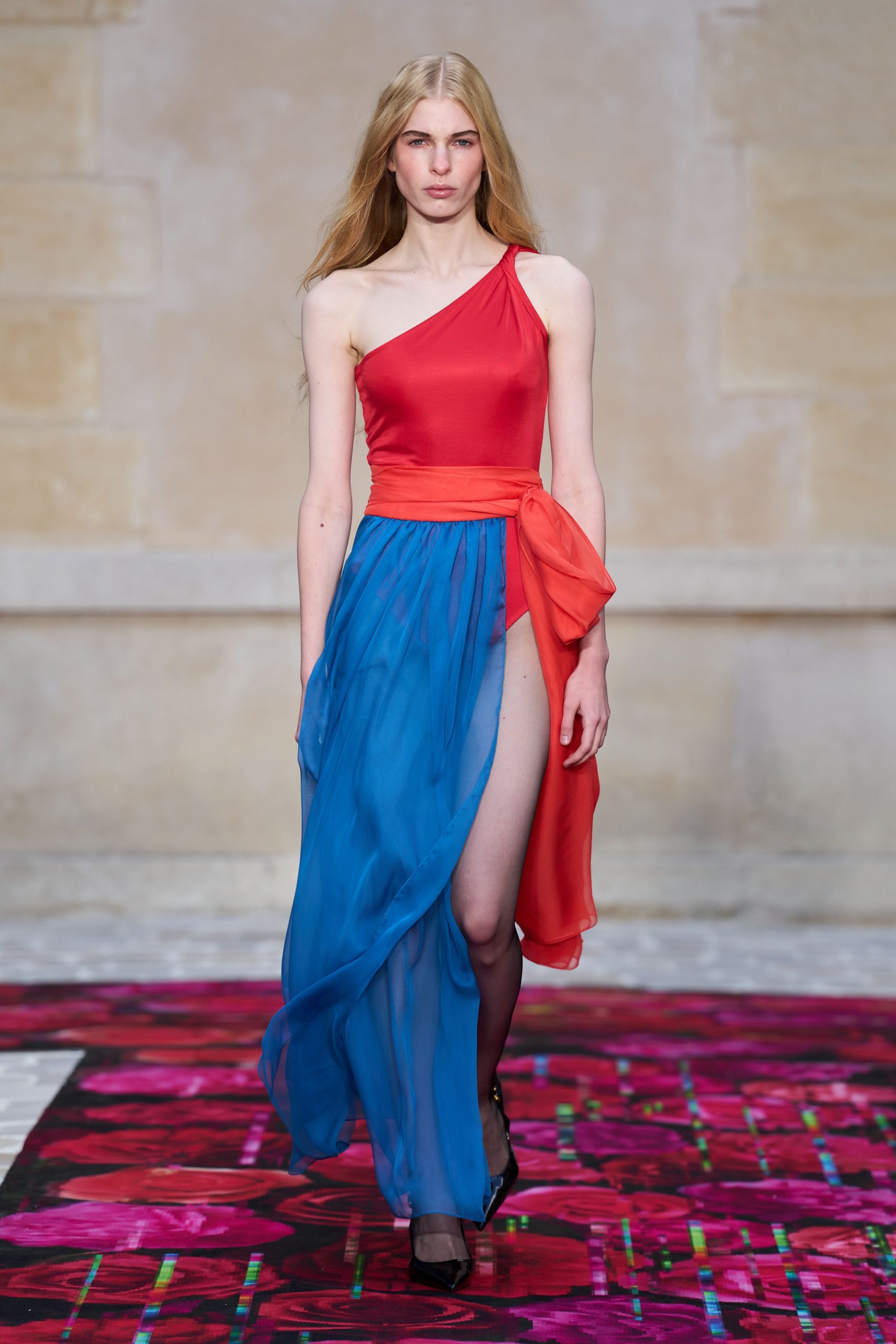 red silk sleeveless high-neck fitted draped flowing gown