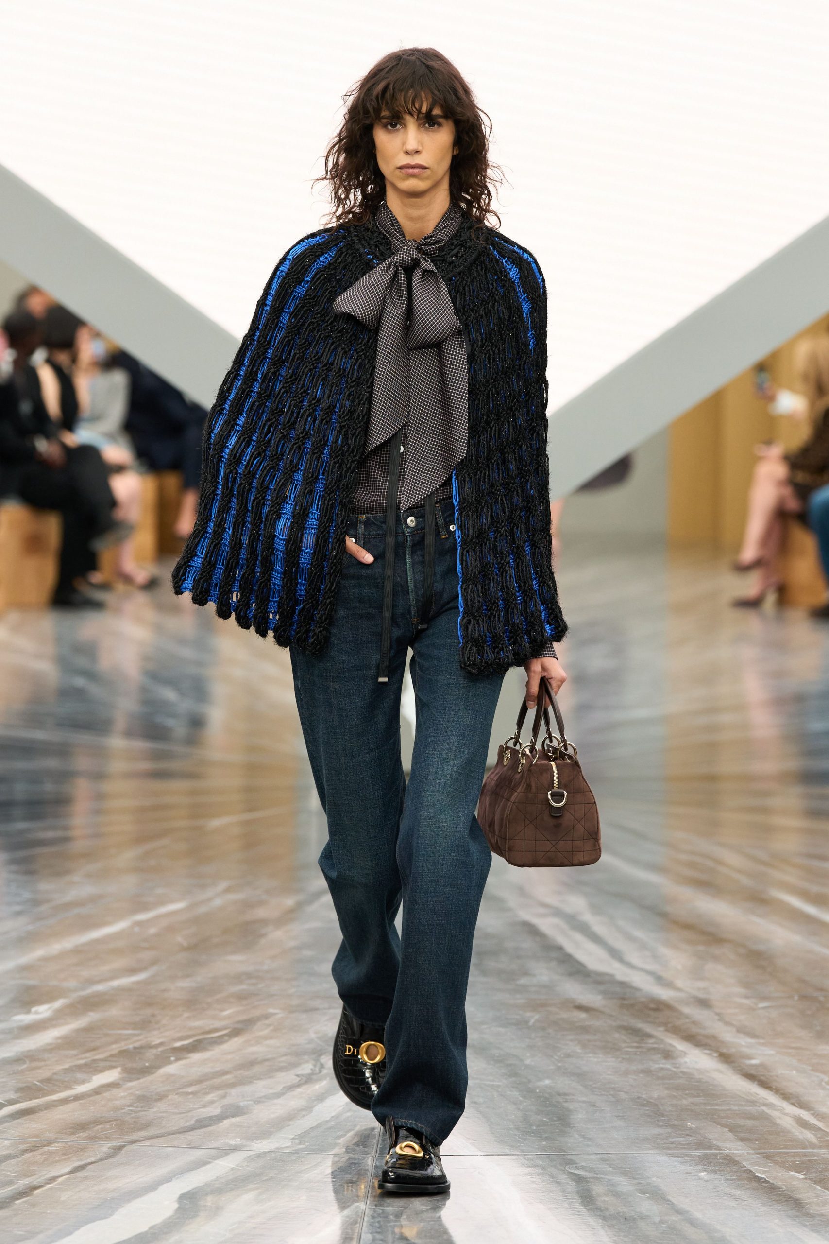 black and blue layered top with denim pants