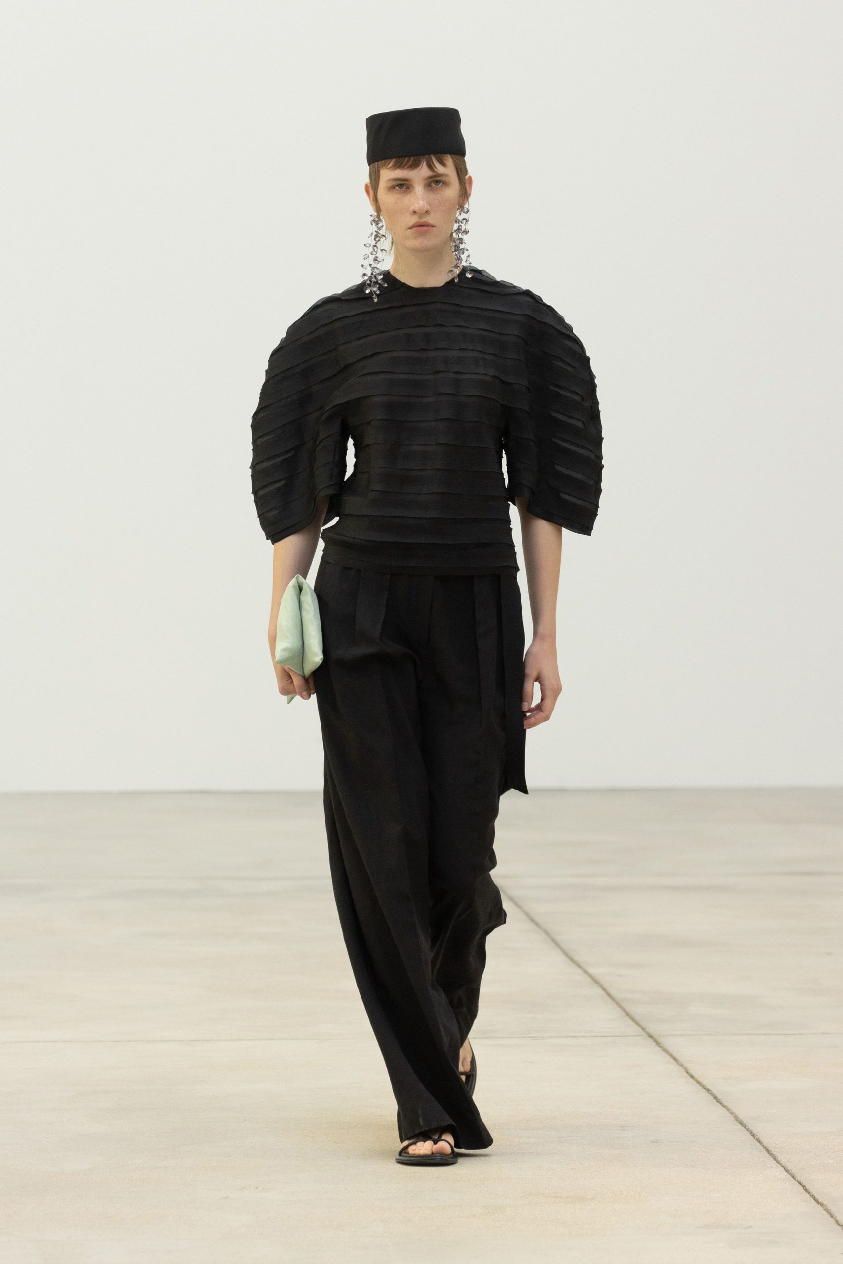 black pleated top with relaxed pants
