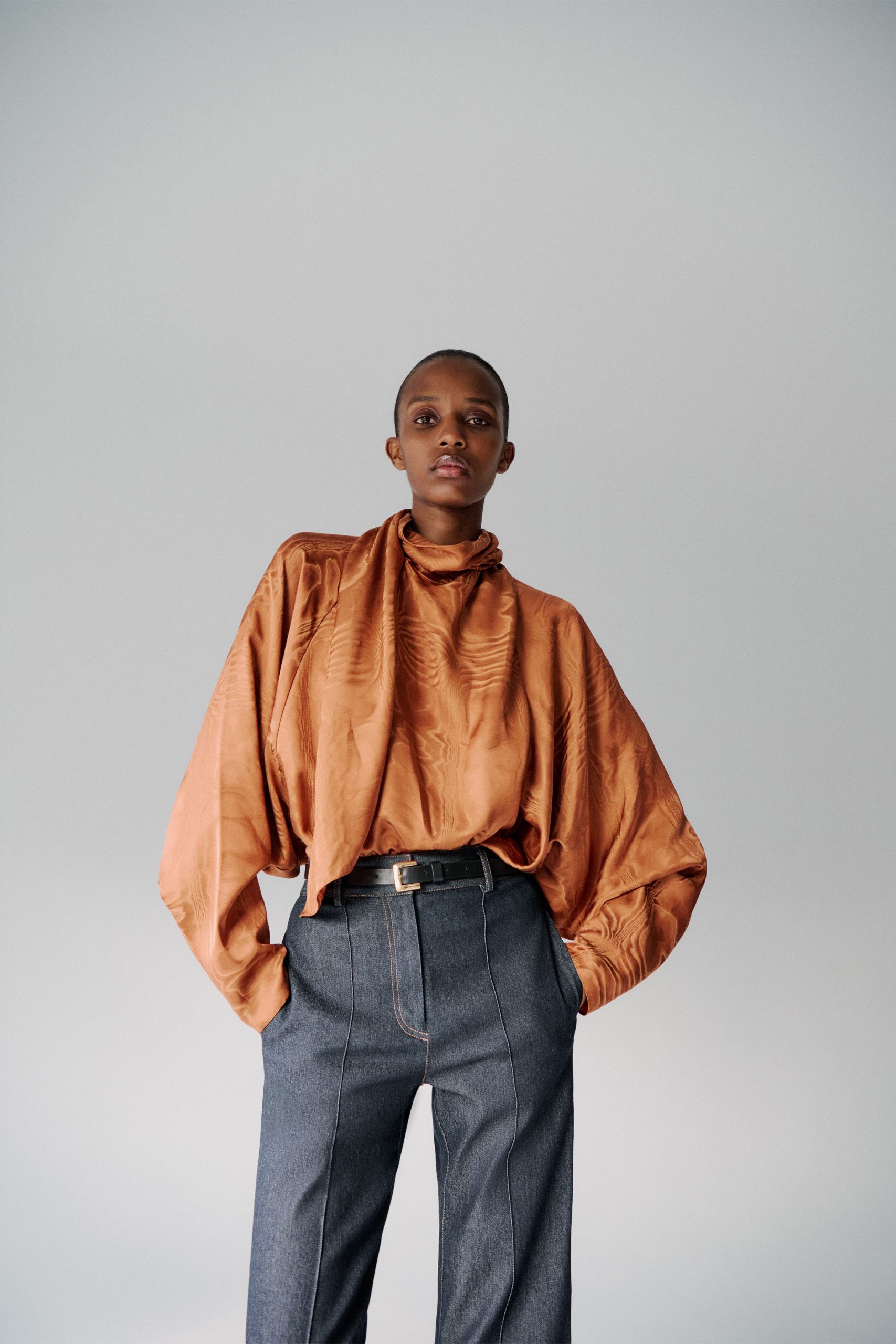 orange silk long-sleeve collared oversized pleated top
