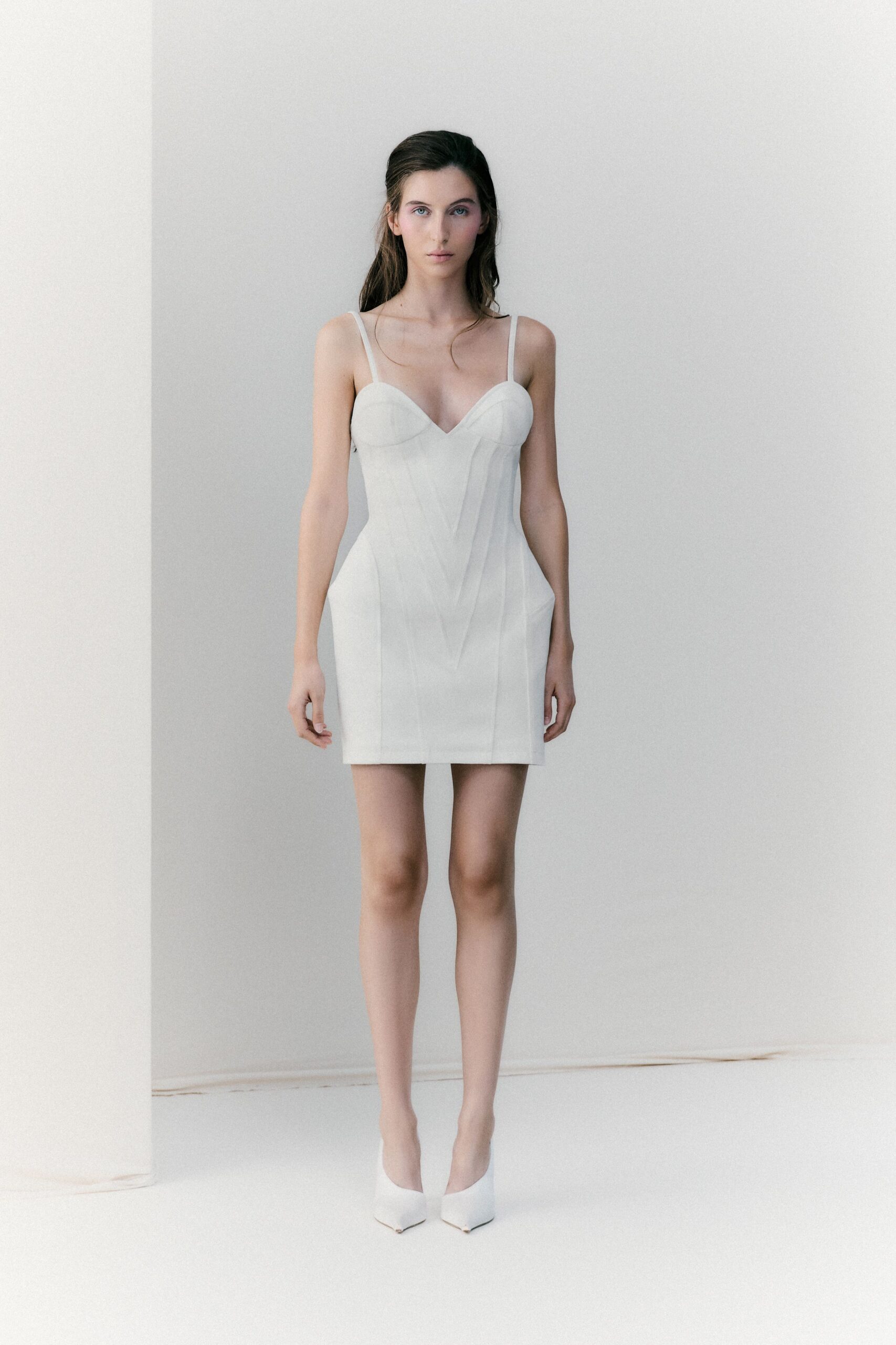 white fitted mini dress with heels