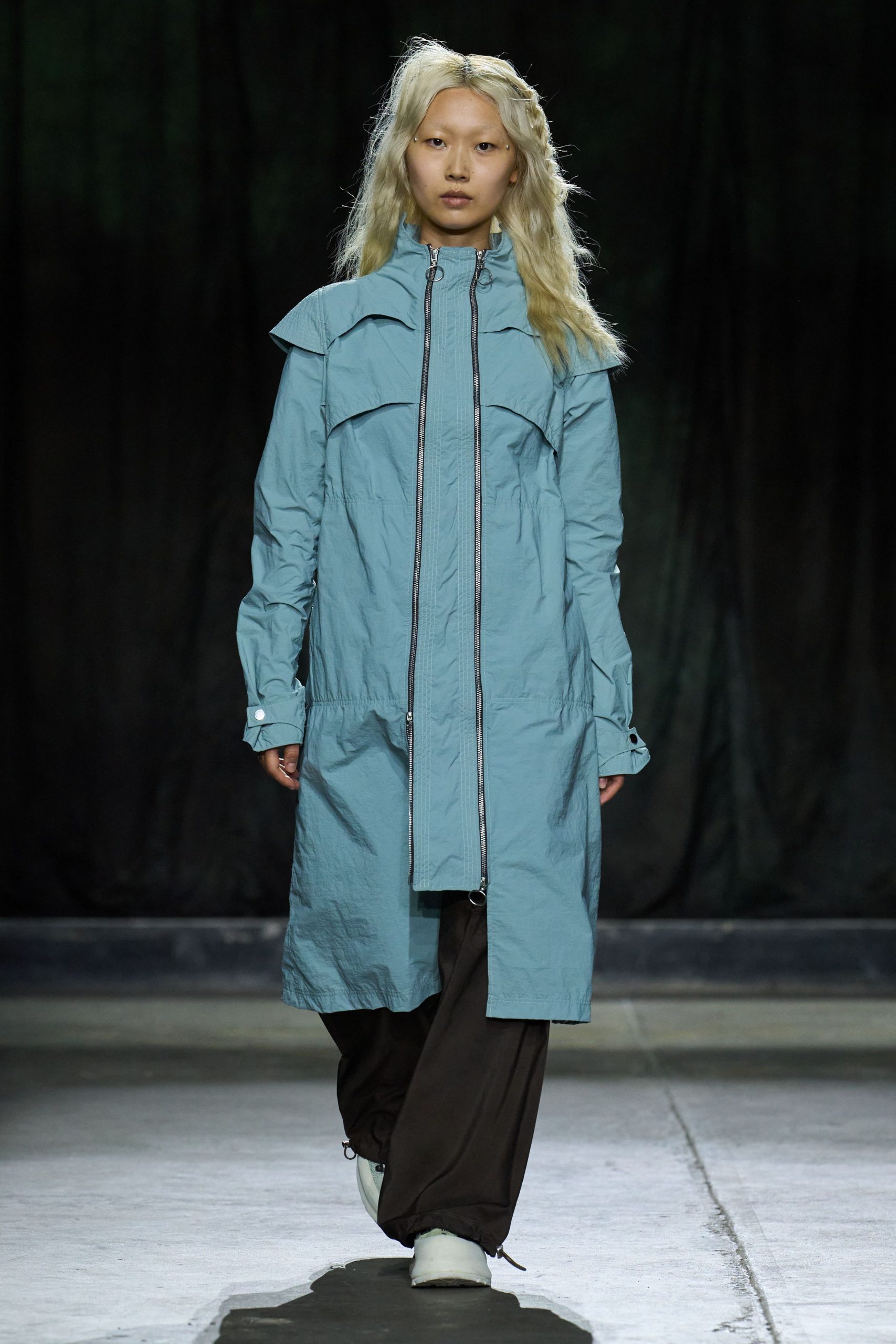 blue relaxed coat with brown pants