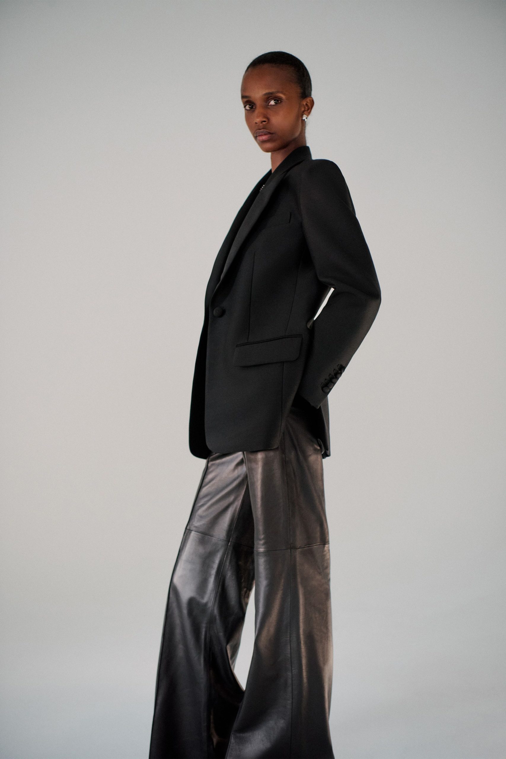 black tailored blazer and leather pants