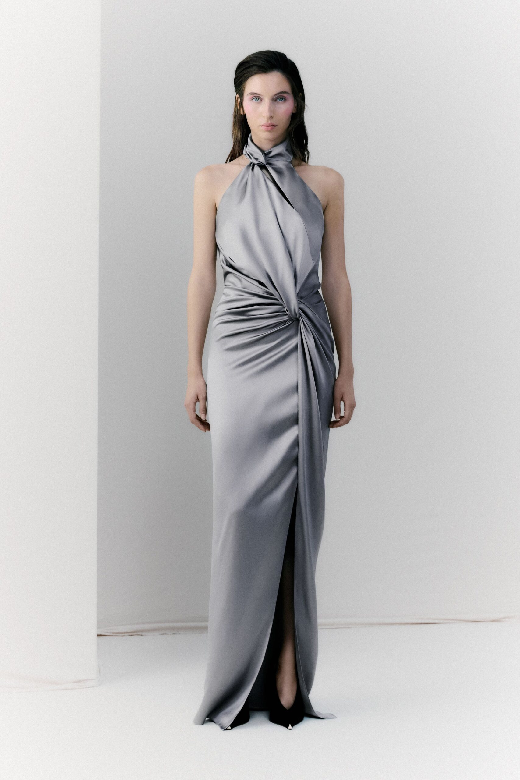 gray silk sleeveless high-neck fitted ruched flowing gown