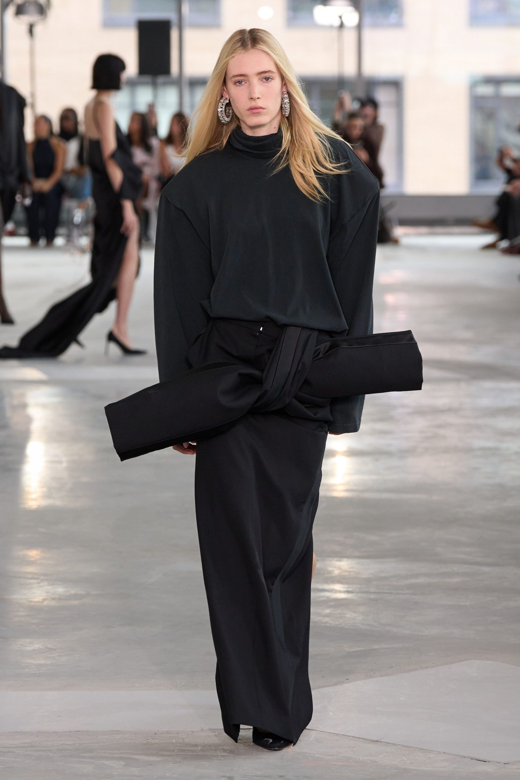 black oversized top and fitted skirt